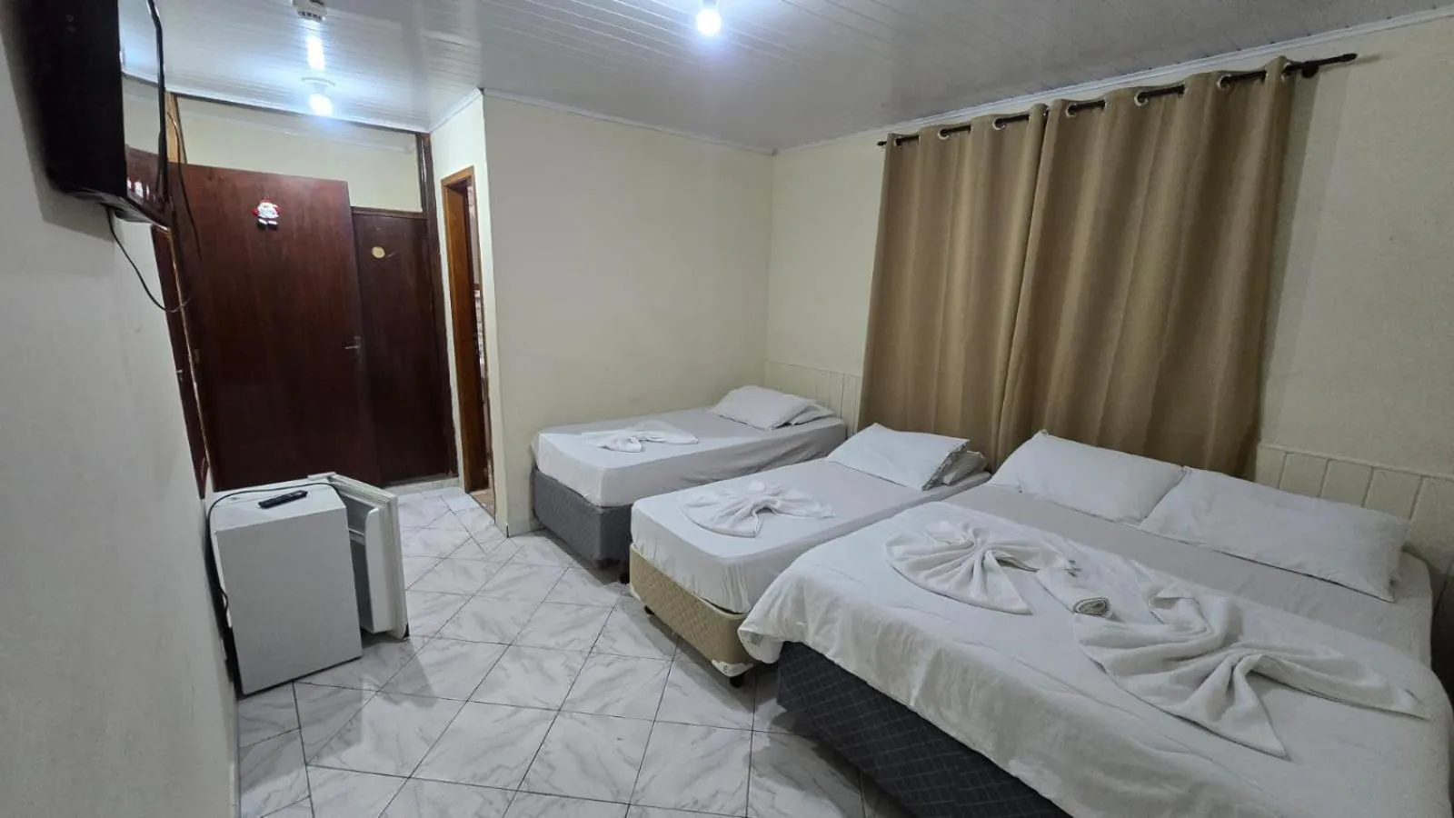 Bed in Pousada Miniférico