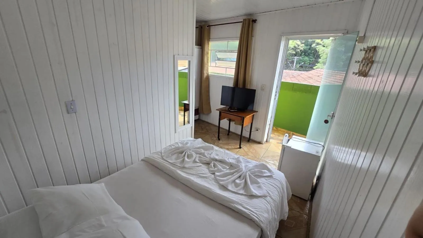 Bed in Pousada Miniférico