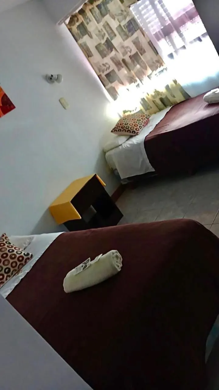 Bed in San Remo Resort Hotel