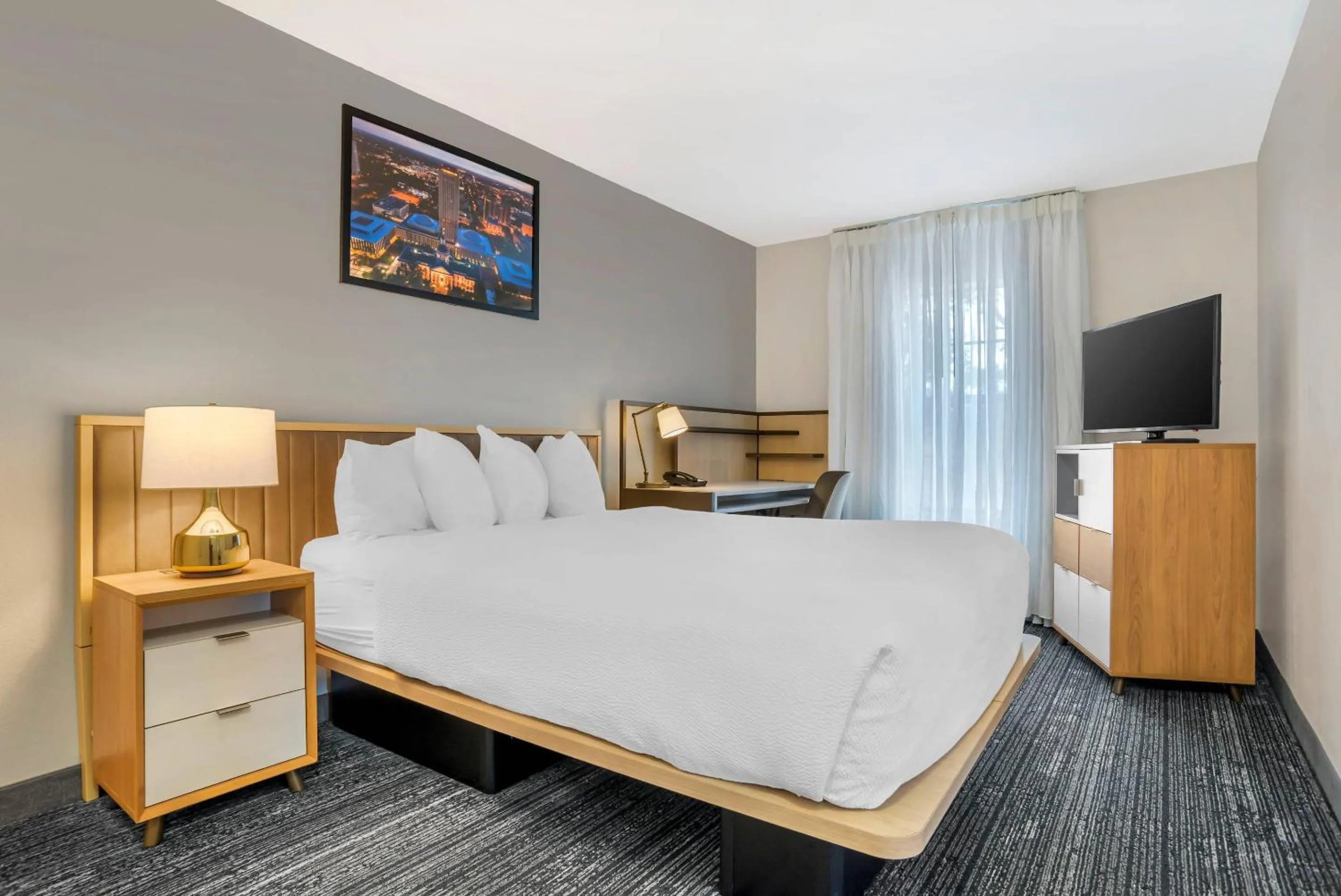 Bedroom in Alluxsuites at 1876, an Ascend Collection Hotel