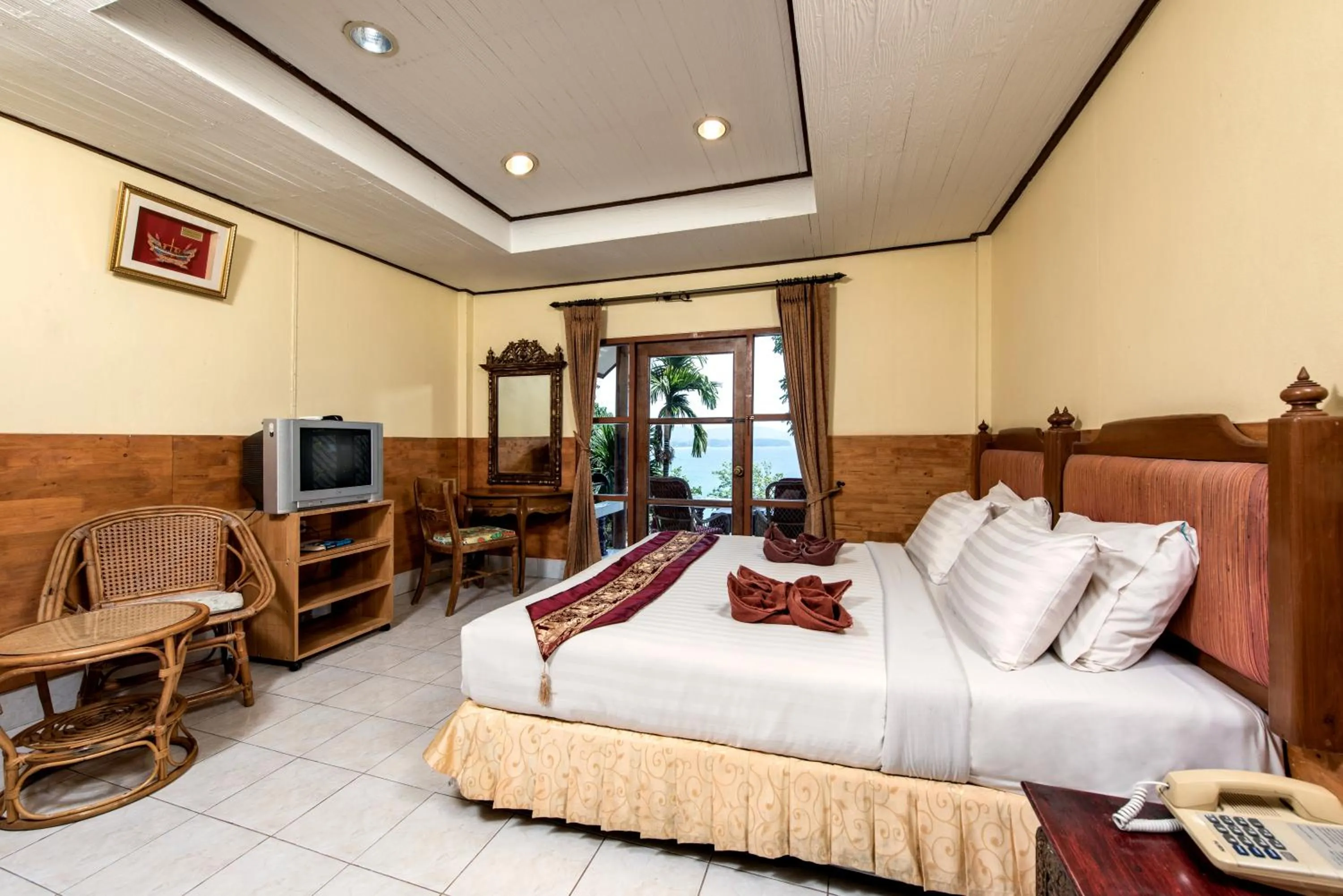 Bed in Baan Karon Hill Phuket Resort