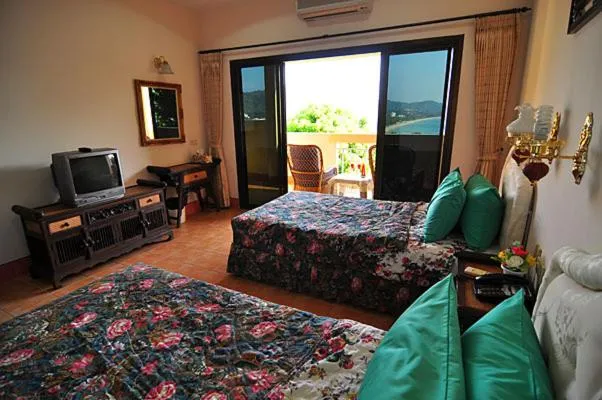 Bed in Baan Karon Hill Phuket Resort