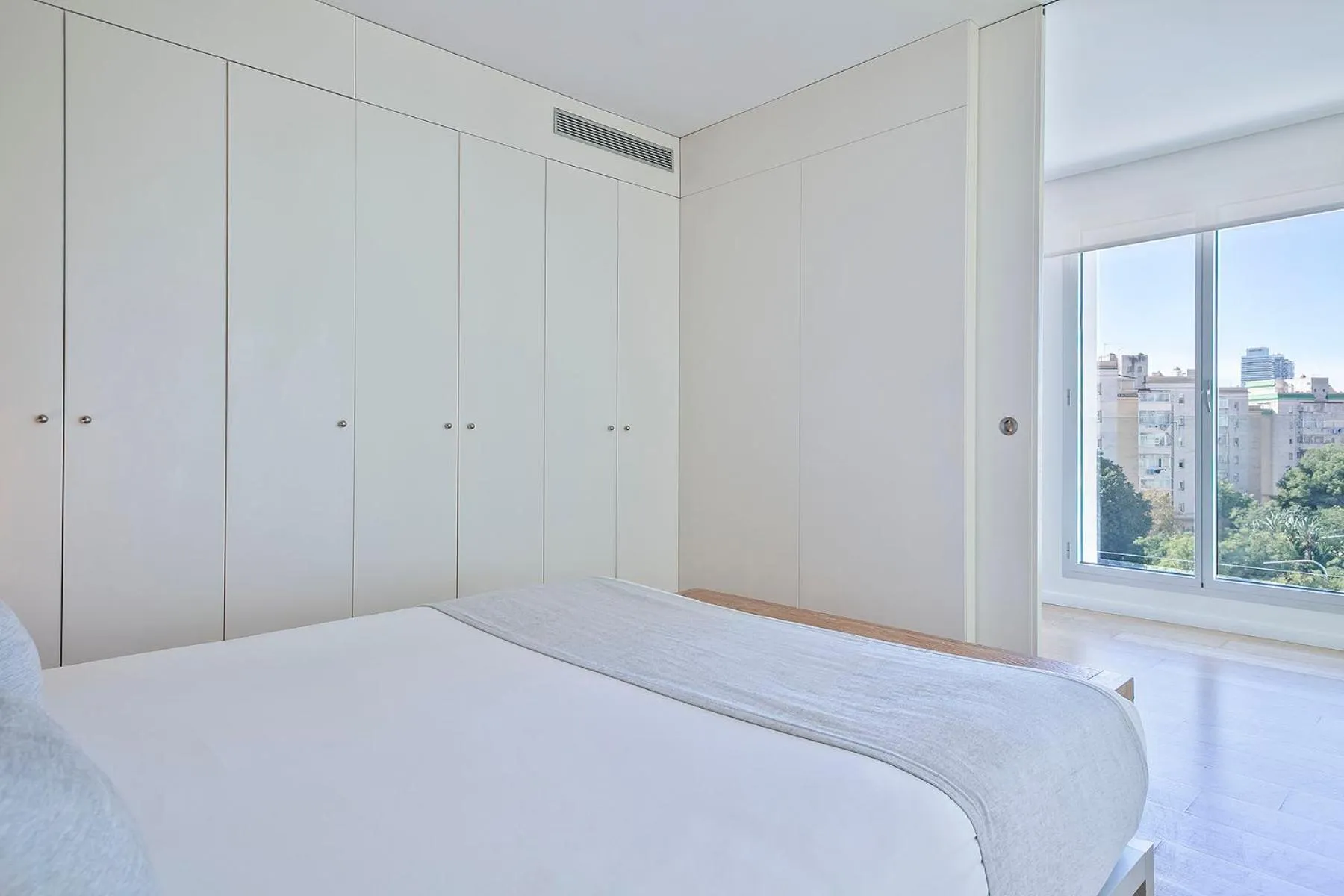 Bed in Lugaris Beach Apartments