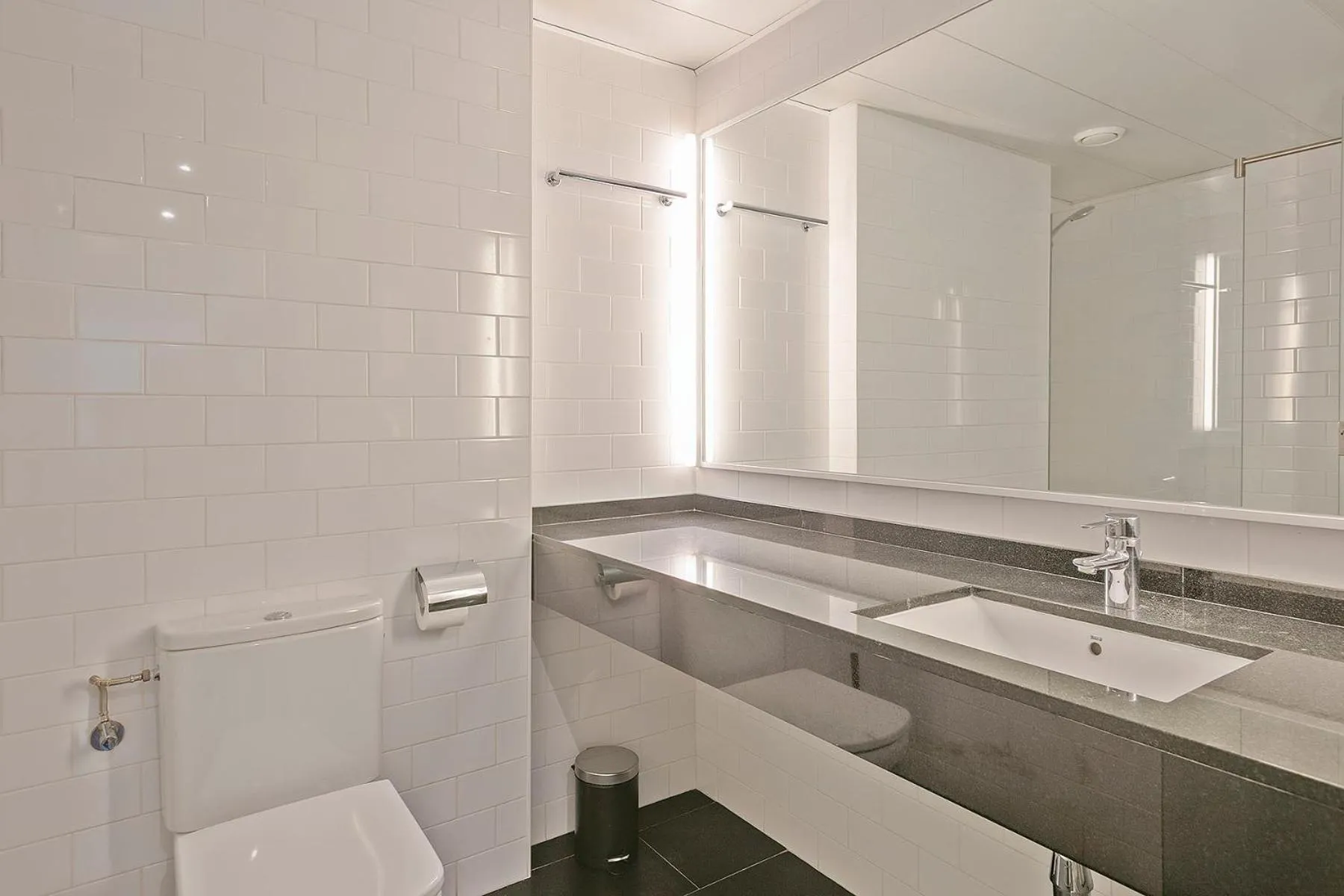 Bathroom in Lugaris Beach Apartments