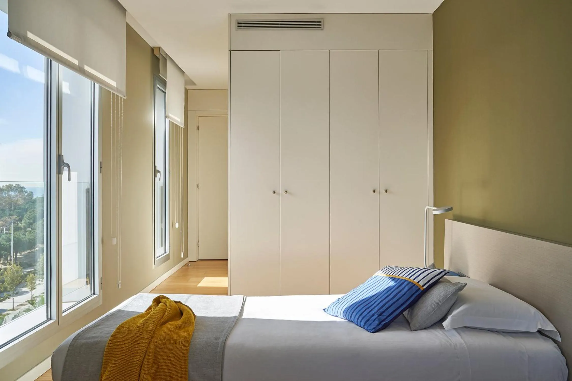 Bed in Lugaris Beach Apartments