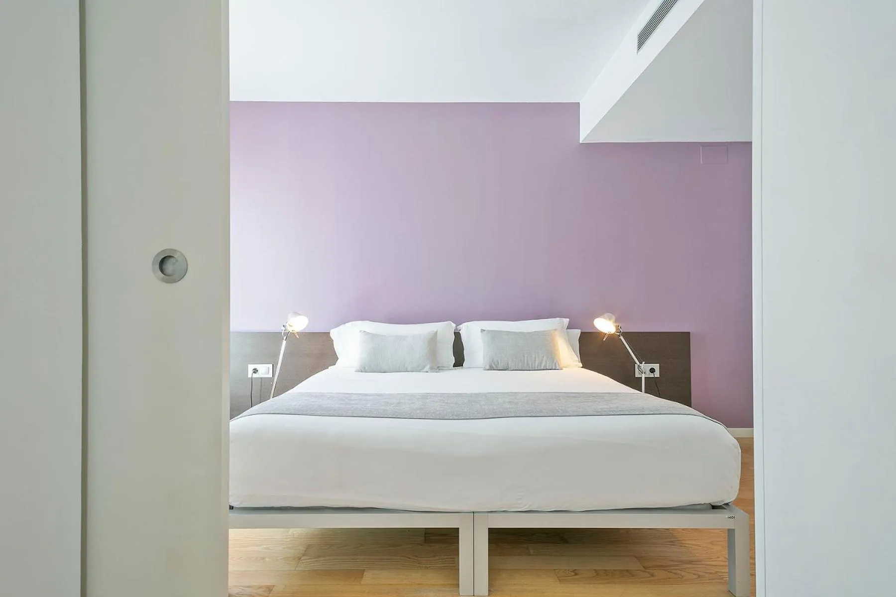 Bed in Lugaris Beach Apartments