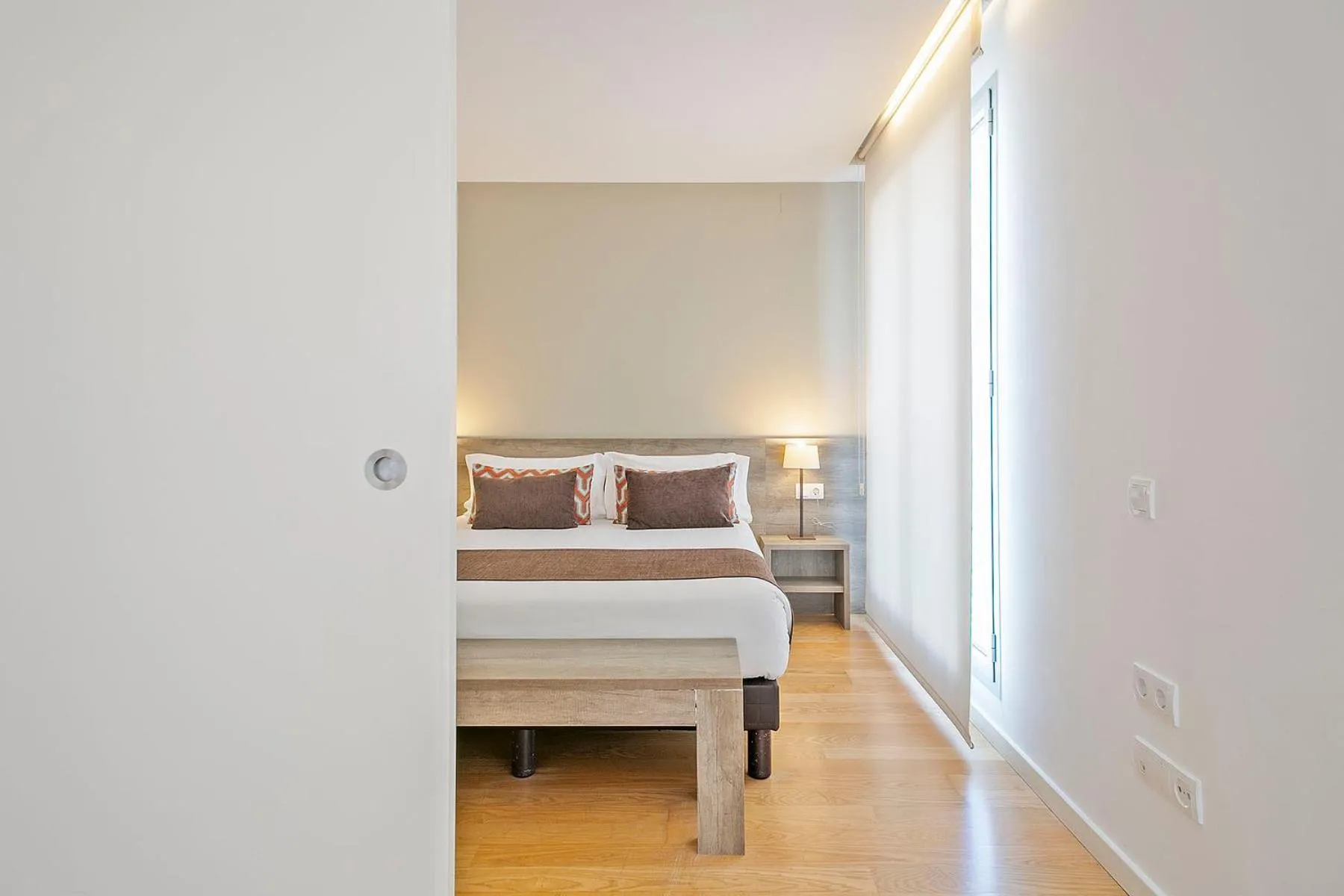 Bed in Lugaris Beach Apartments