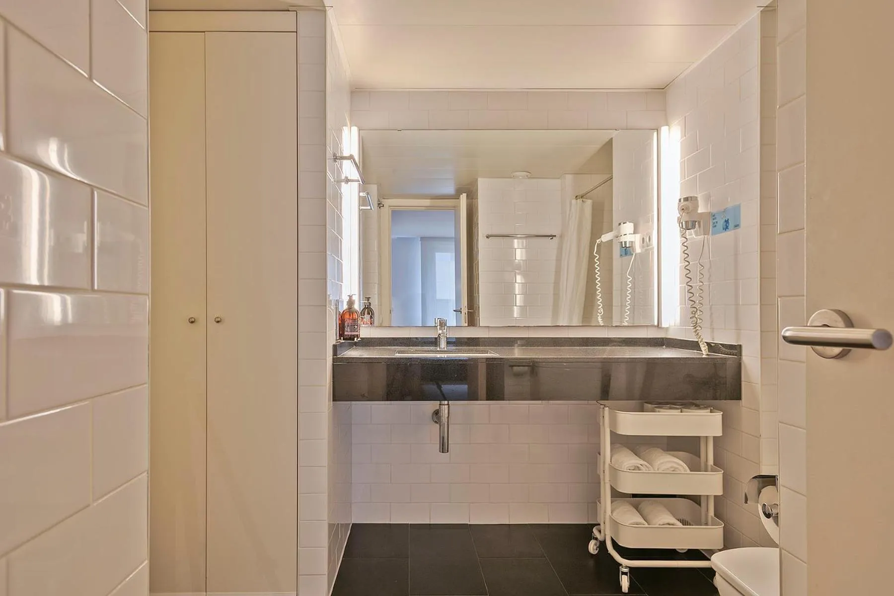 Bathroom in Lugaris Beach Apartments