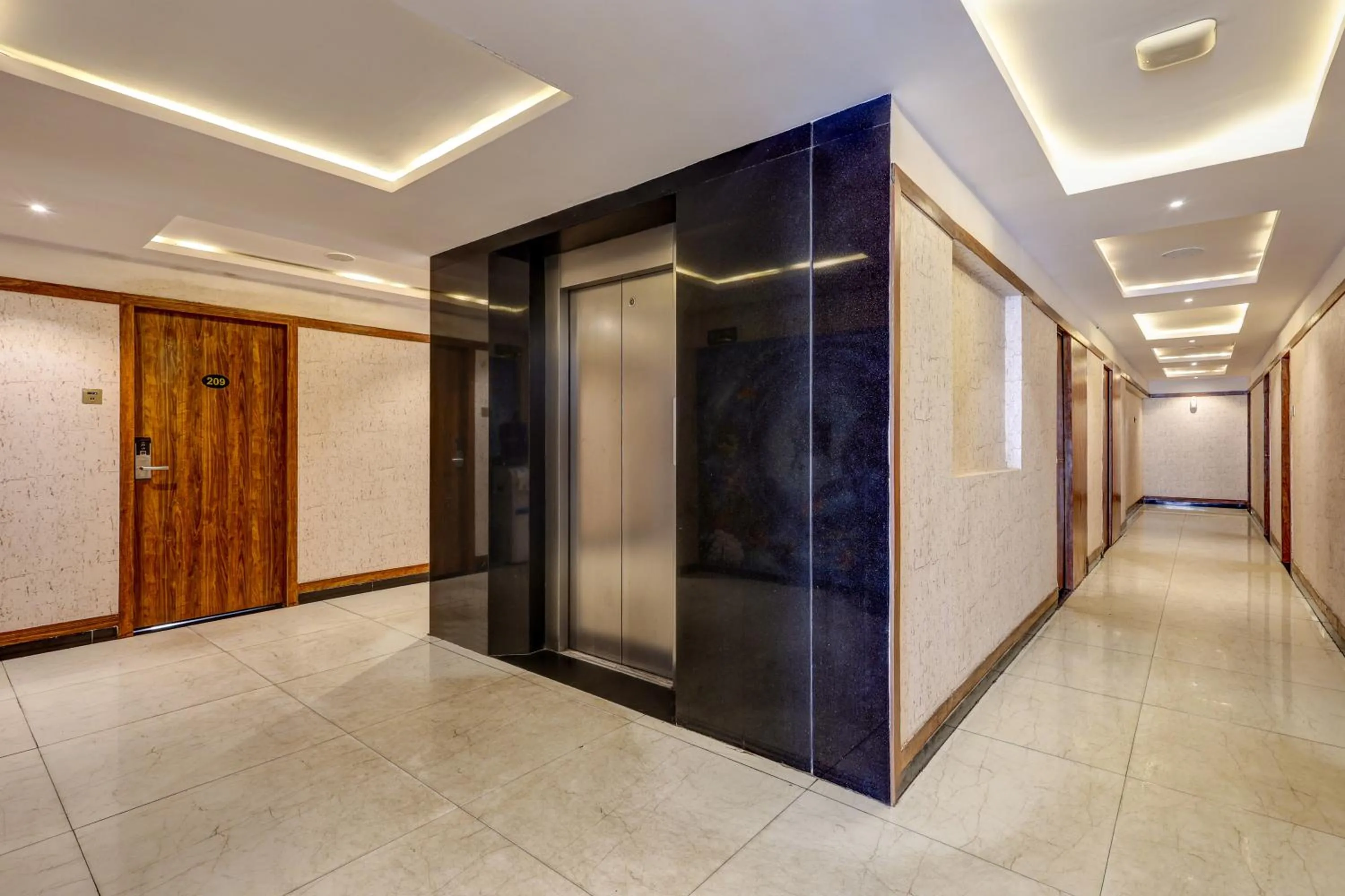 elevator in Treebo Blak & Wite Rk Beach