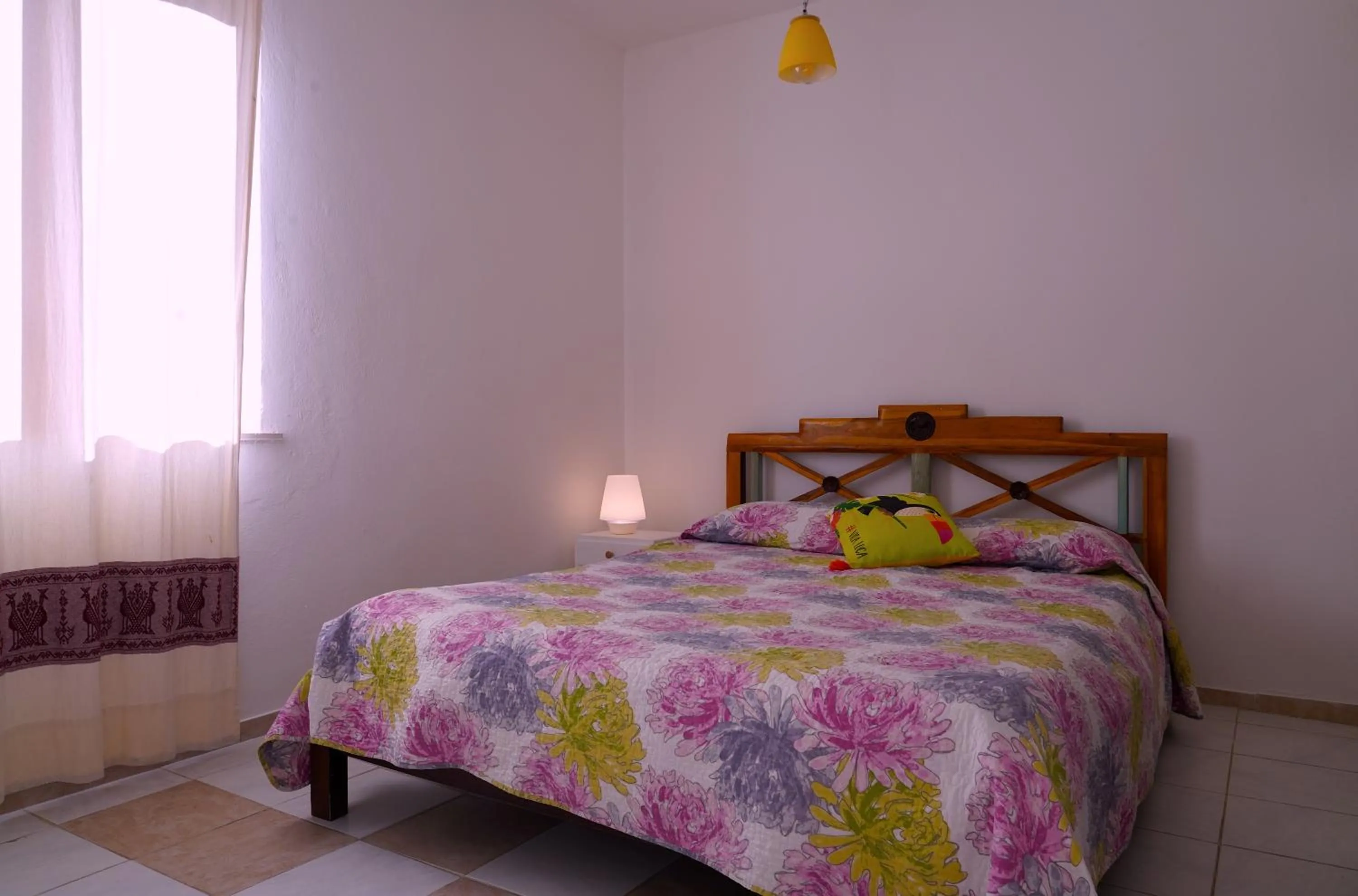 Bed in Flowery Inn Villa