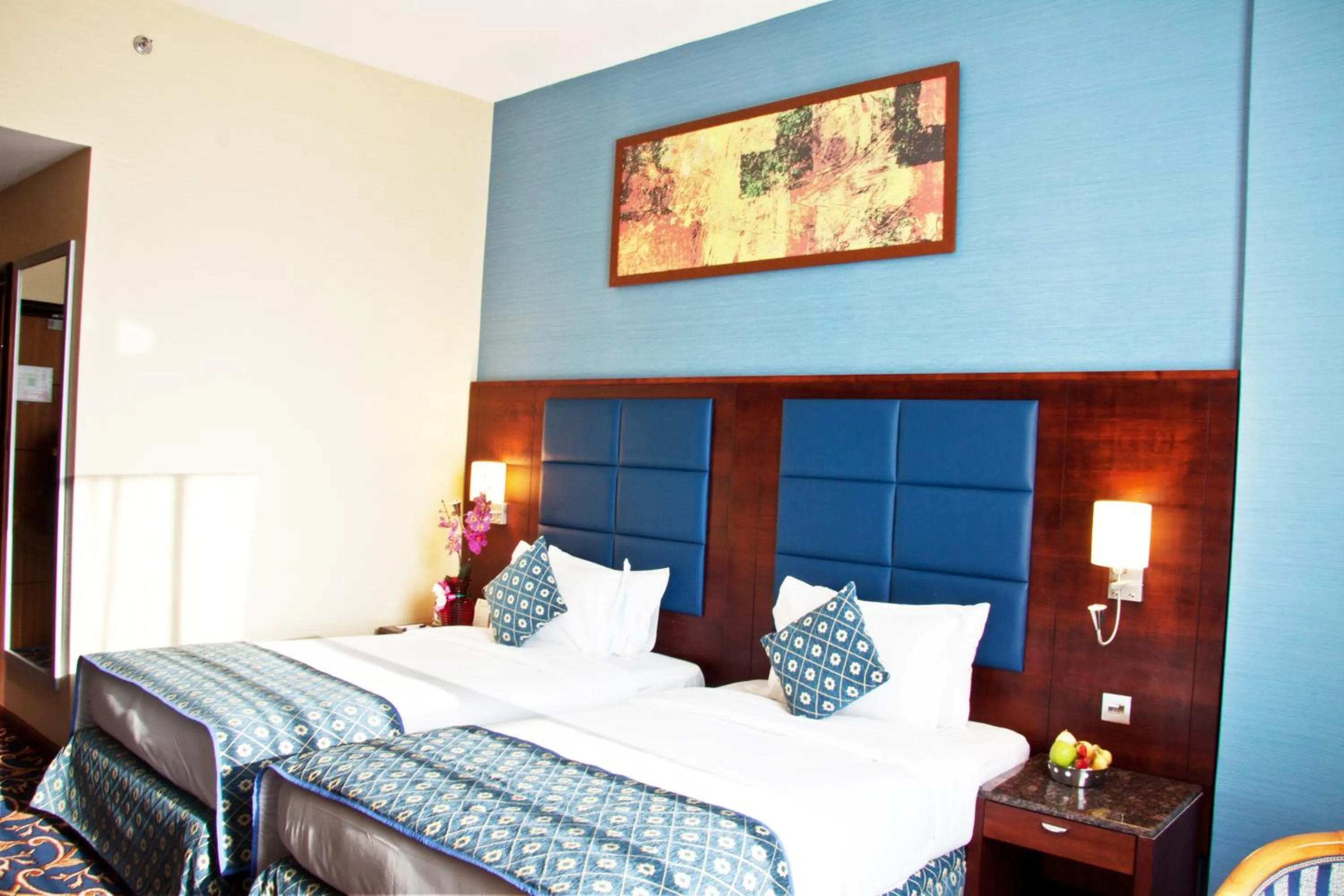 Bed in Ramee Rose Hotel