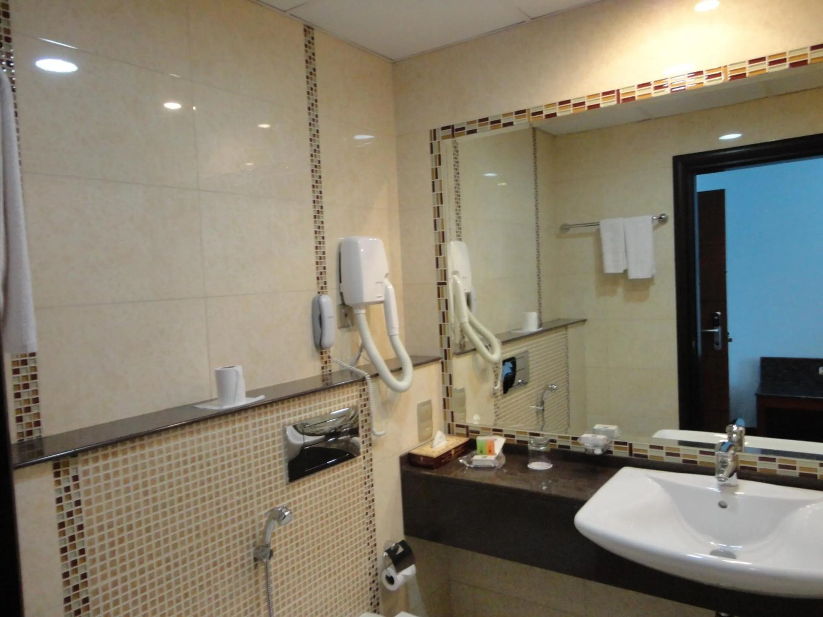 Bathroom in Ramee Rose Hotel