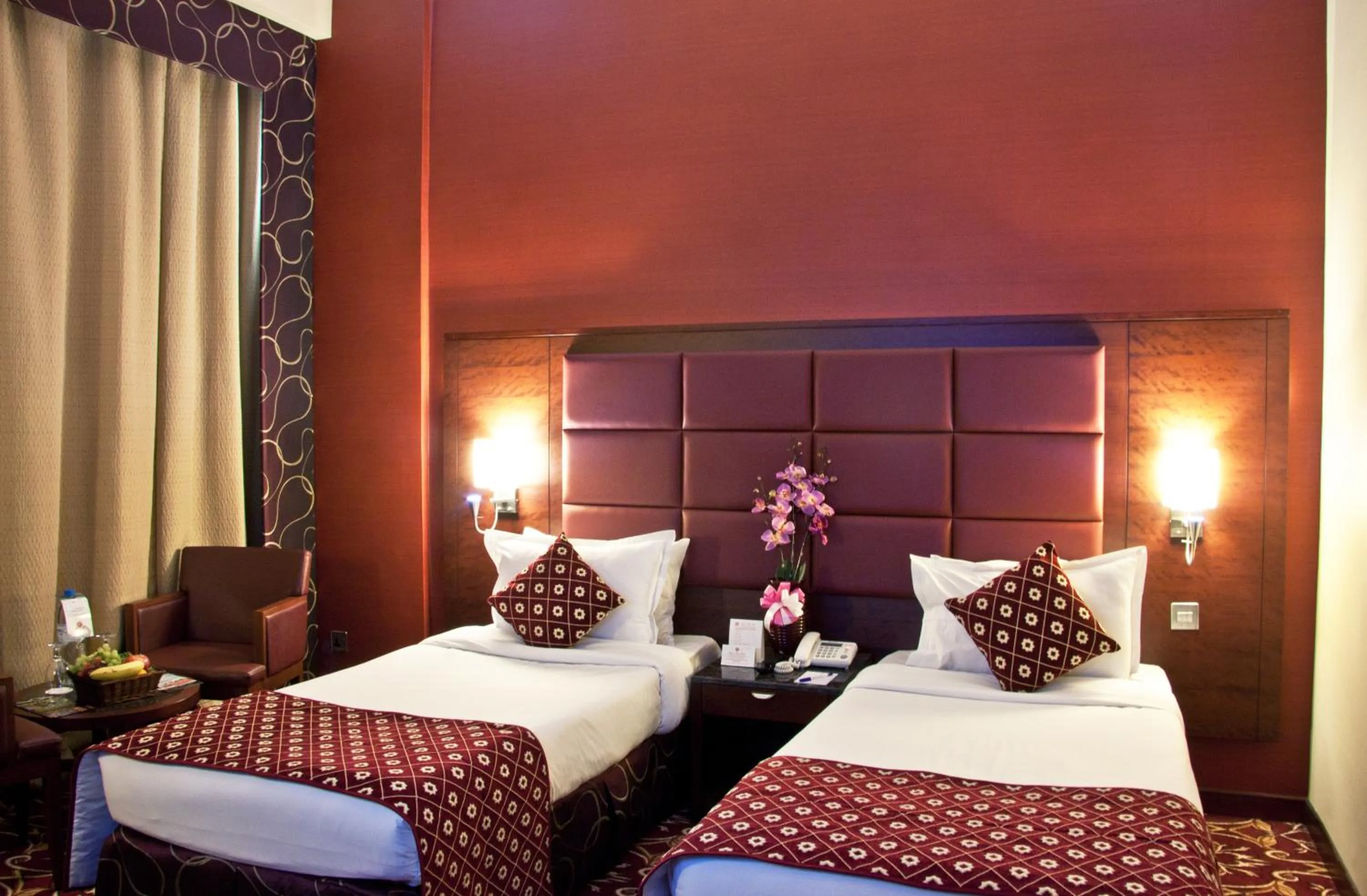 Bed in Ramee Rose Hotel