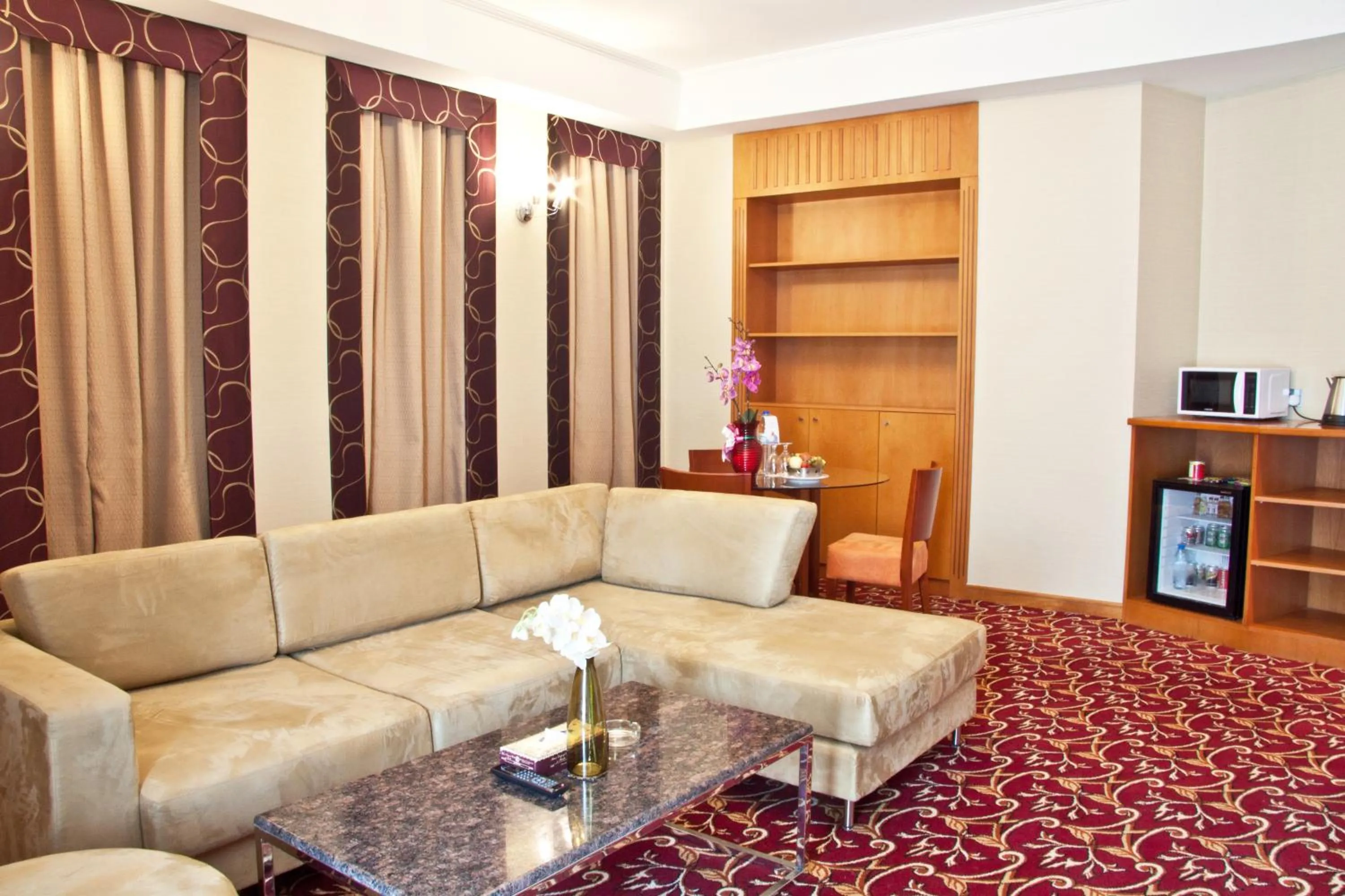 Living room in Ramee Rose Hotel