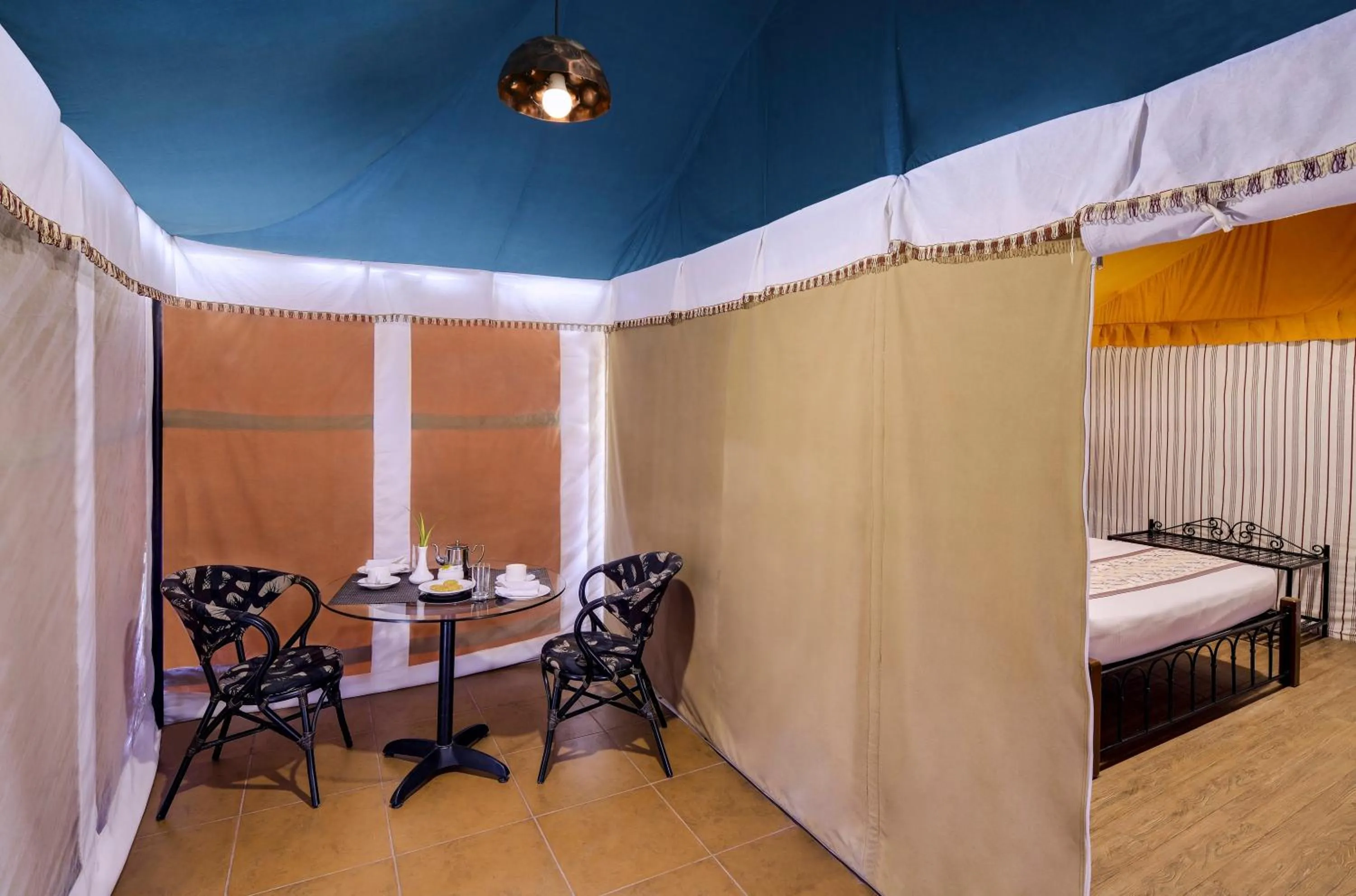 Seating area, Bed in Sterling Kanha