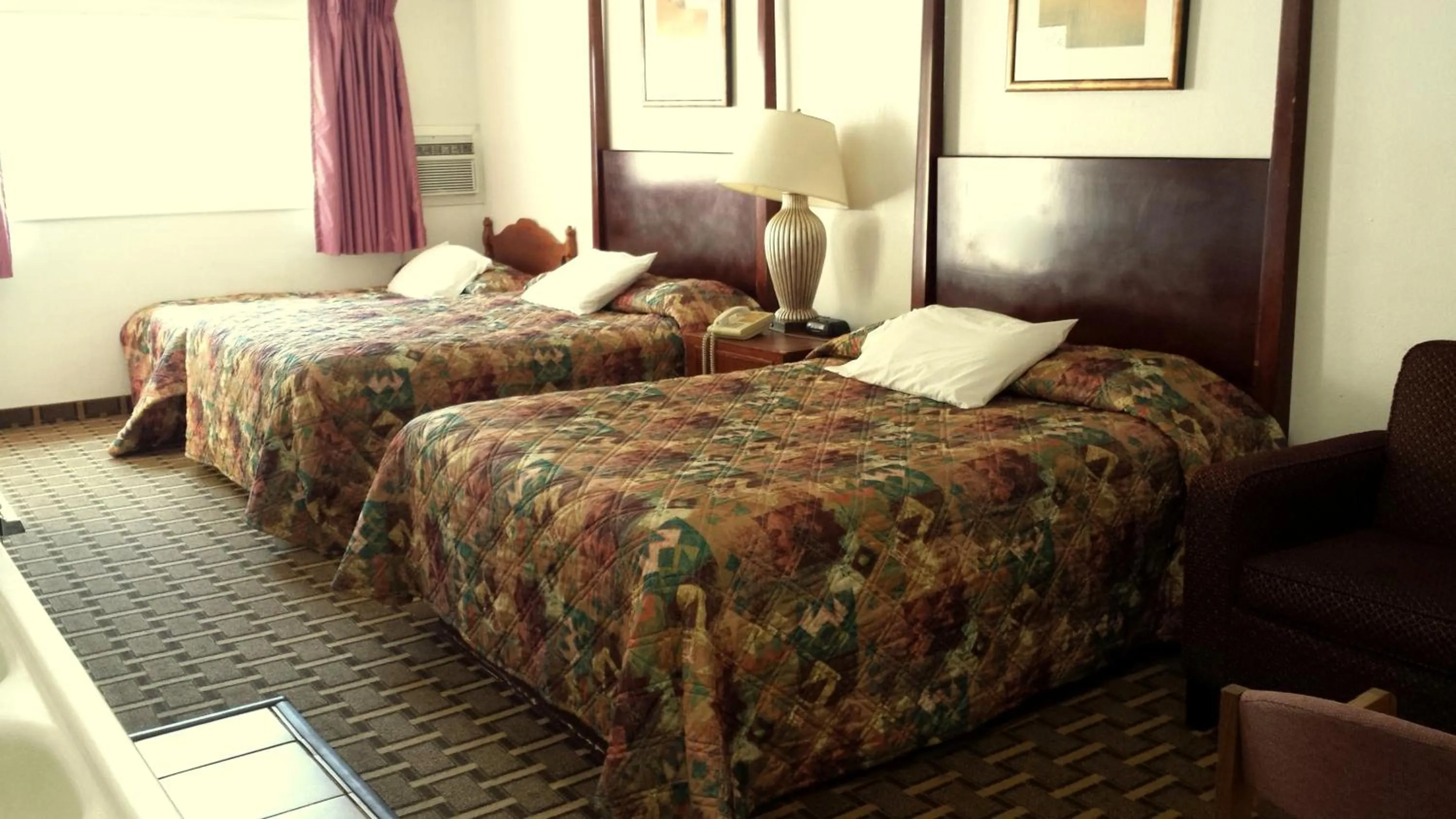 Bedroom in Executive Inn & Suites