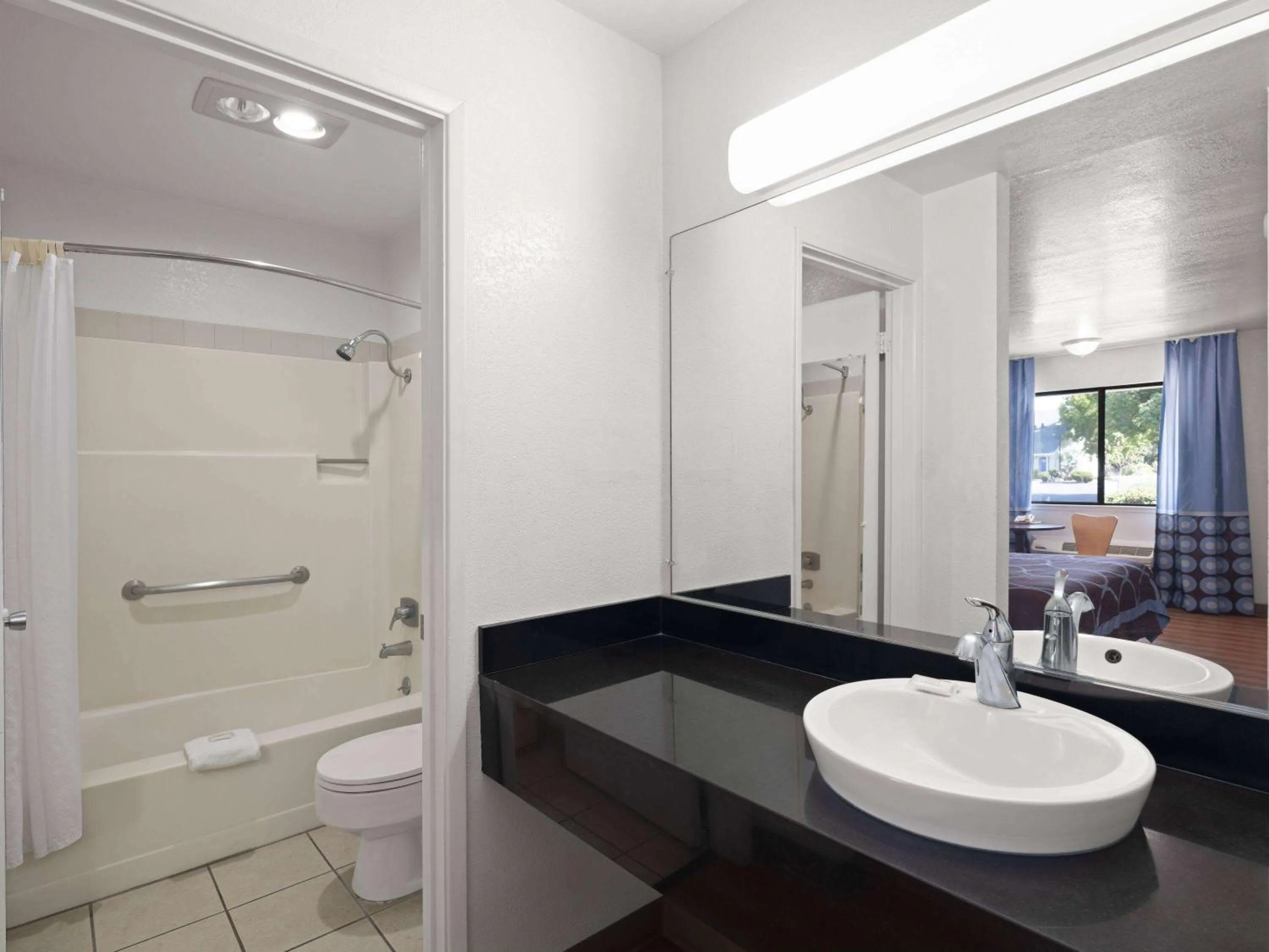 Bathroom in Super 8 by Wyndham Dunnigan