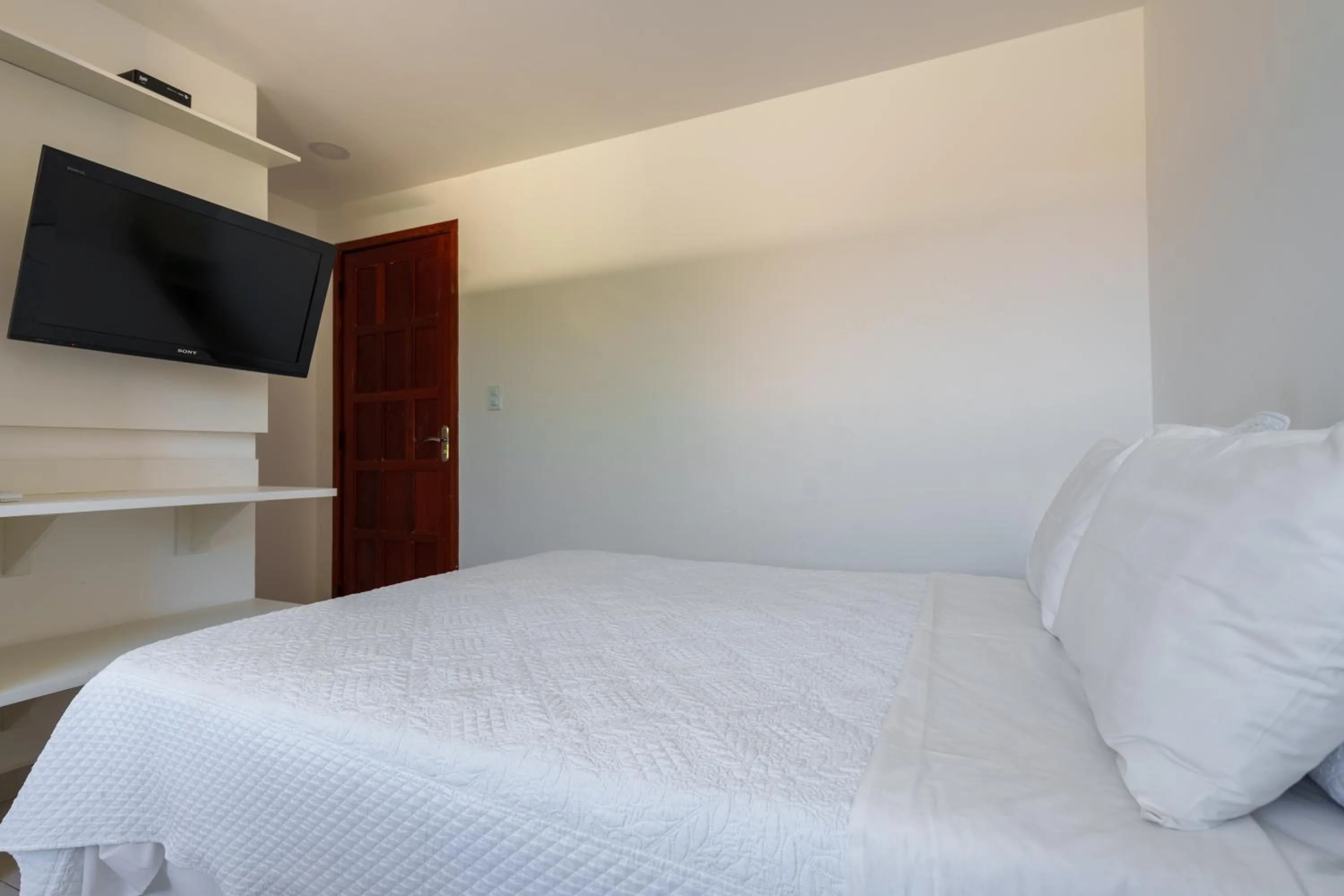 Bed in Pousada do Timoneiro