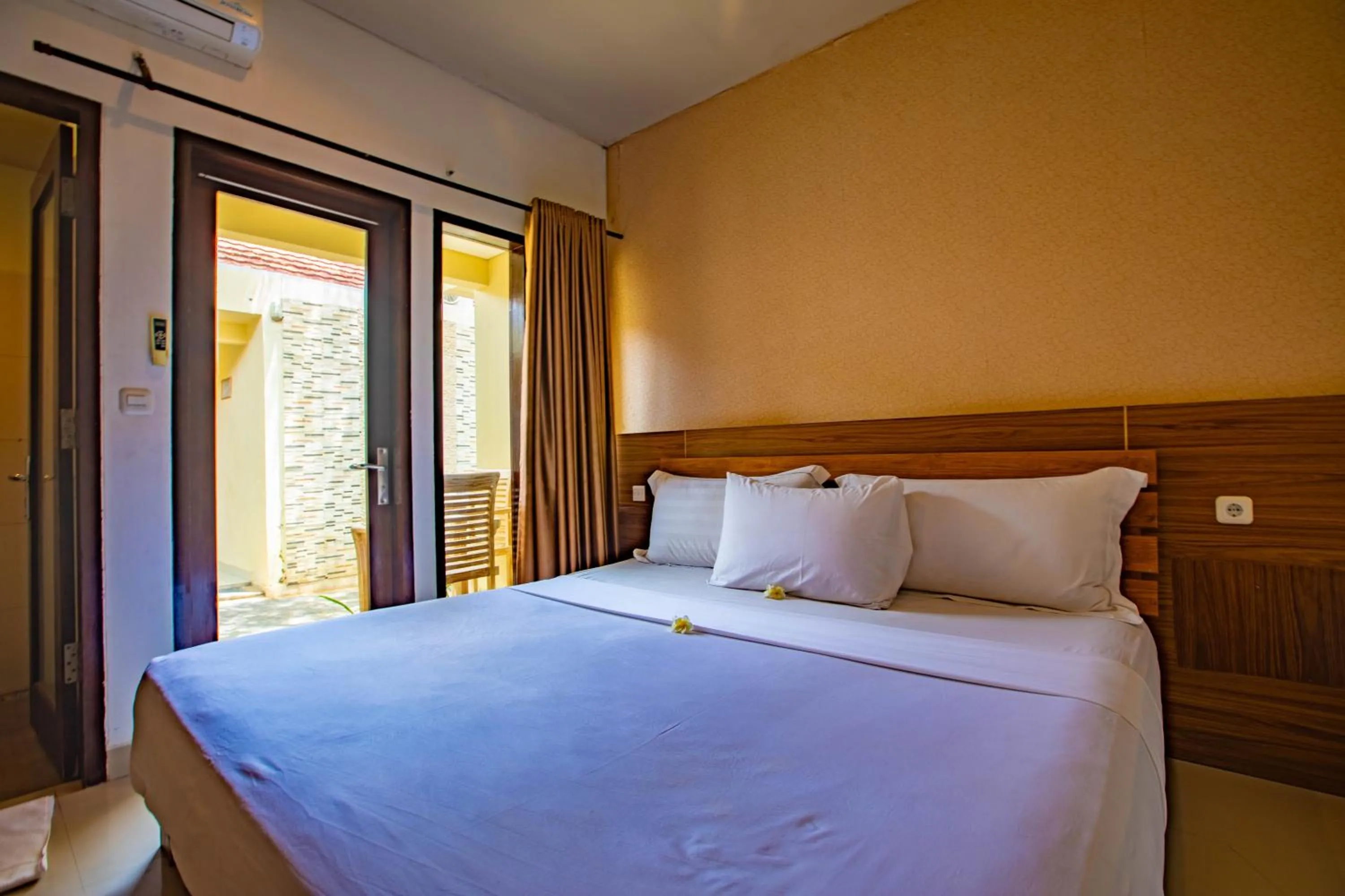 Bed in Gili Sands Hotel & Bar