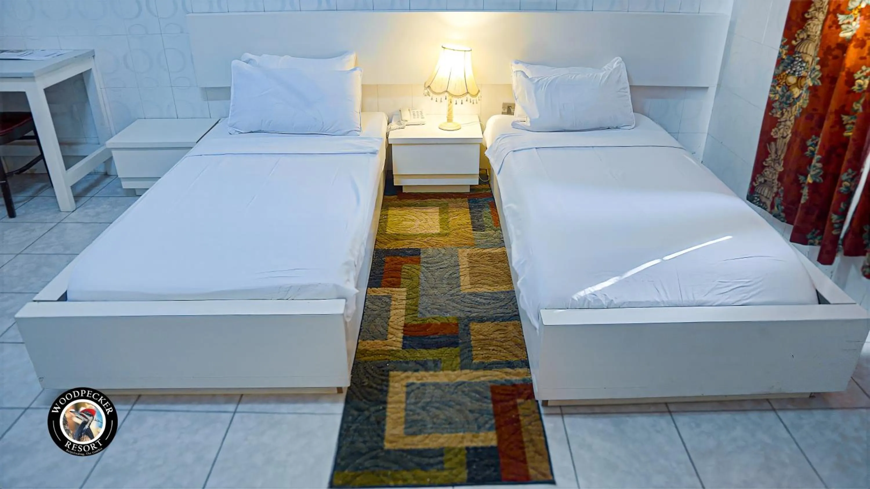 Bed in Woodpecker Resort Hotel