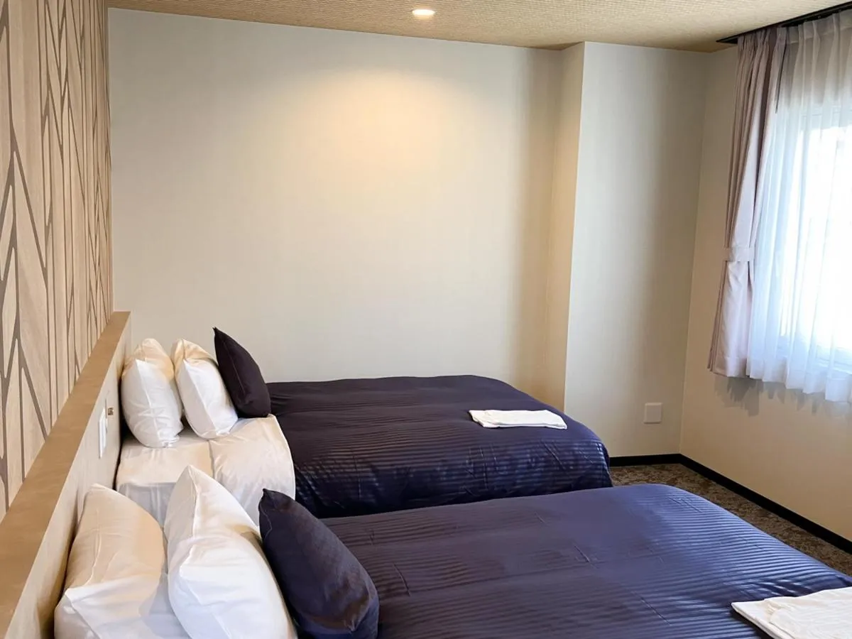 Bed in HOTEL LiVEMAX BUDGET Hiratsuka Ekimae