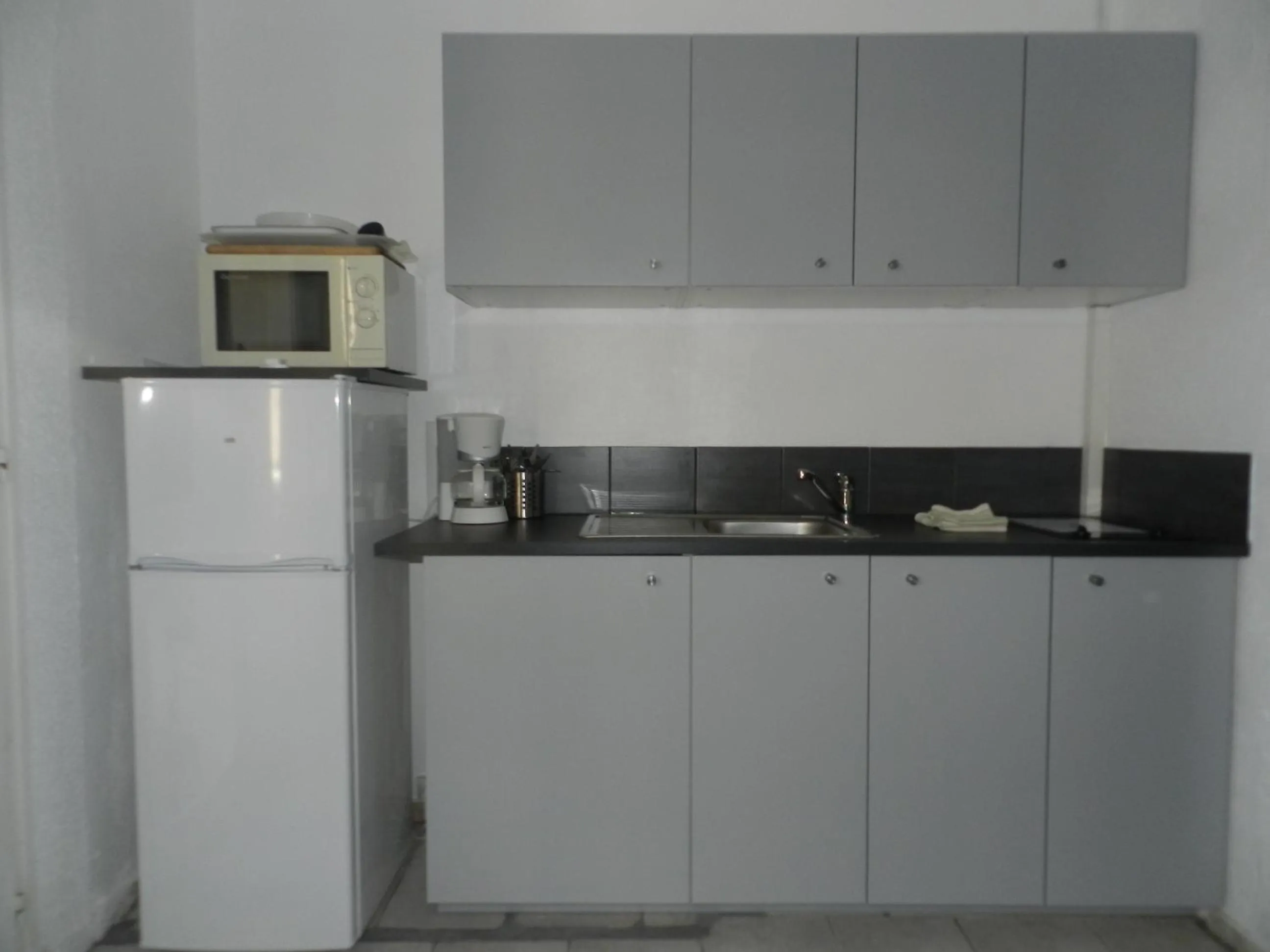 Kitchen or kitchenette in Hotel L'Orangeraie