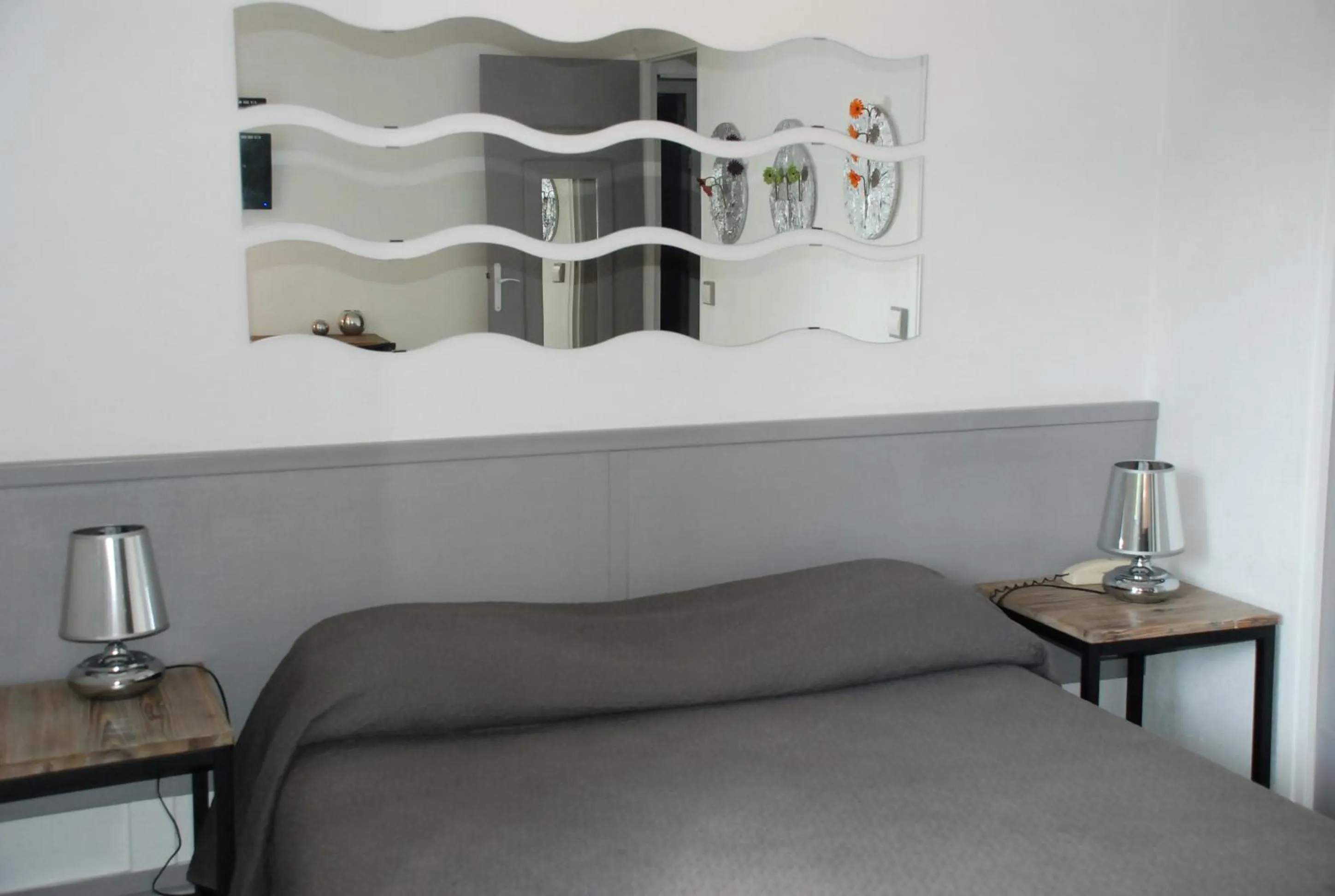 Bedroom in Hotel L'Orangeraie