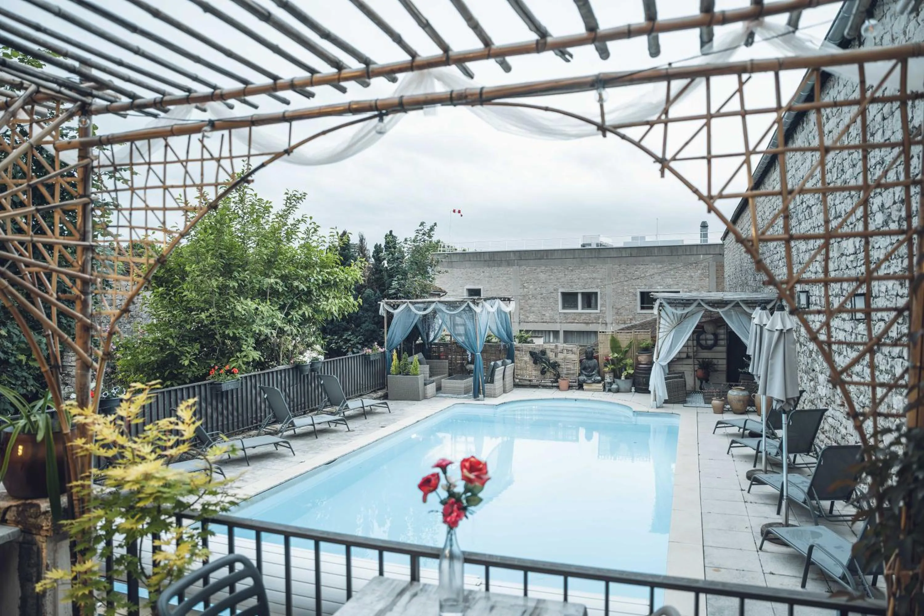 Swimming pool in Logis Hôtel Vuillot
