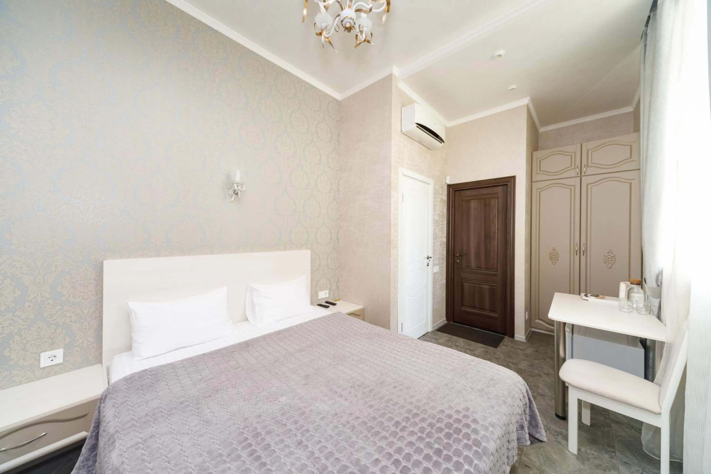 Bed in L.O.Y Family Hotel