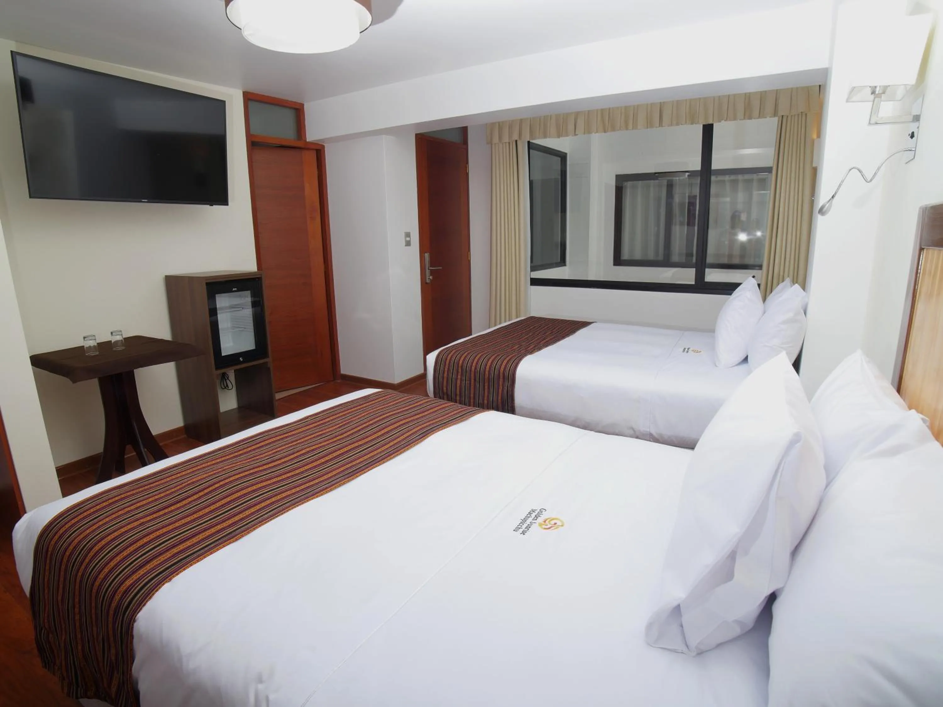 Photo of the whole room, Bed in Golden Sunrise Machupicchu