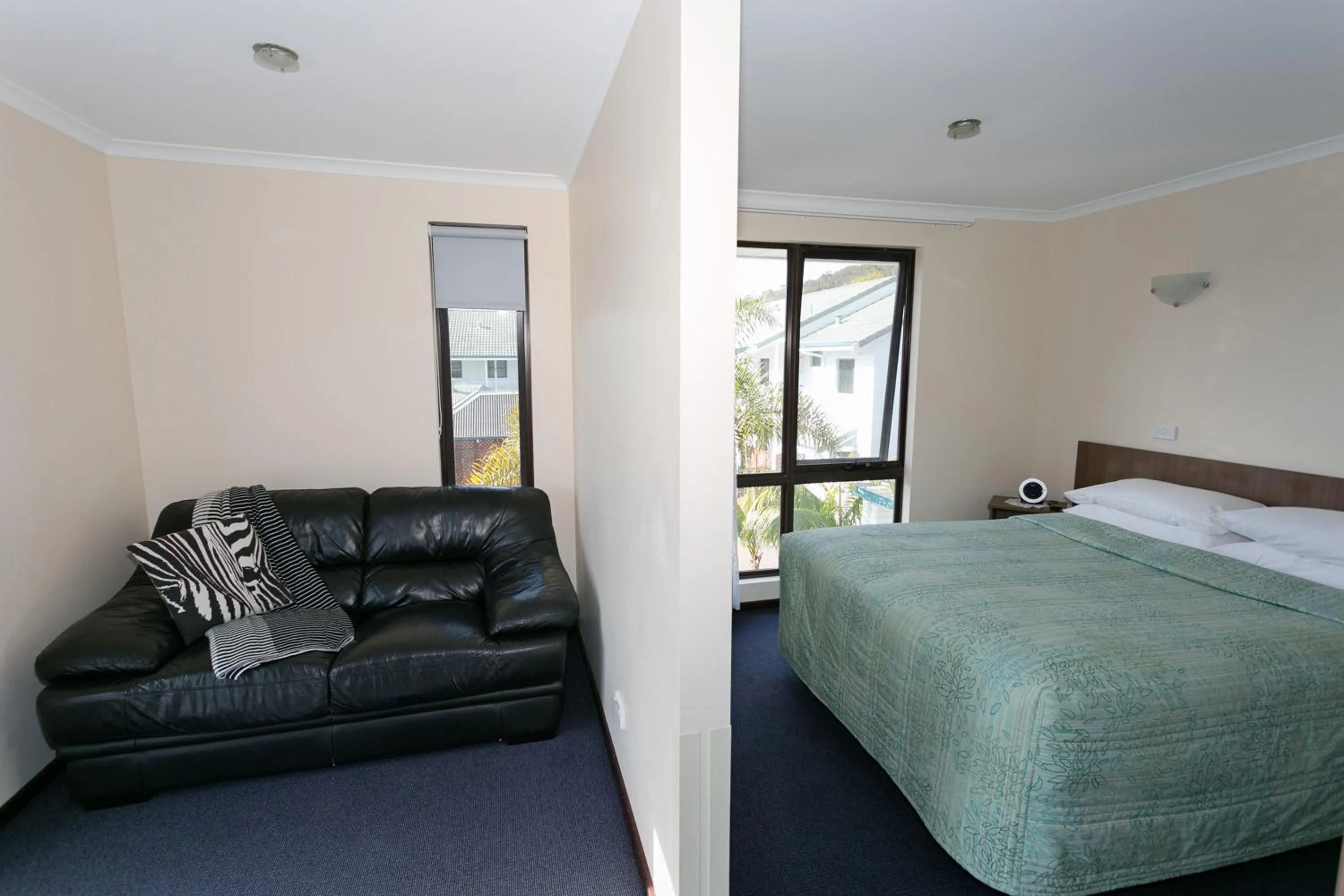 Living room, Bed in Dolphin Lodge Albany - Self Contained Apartments at Middleton Beach