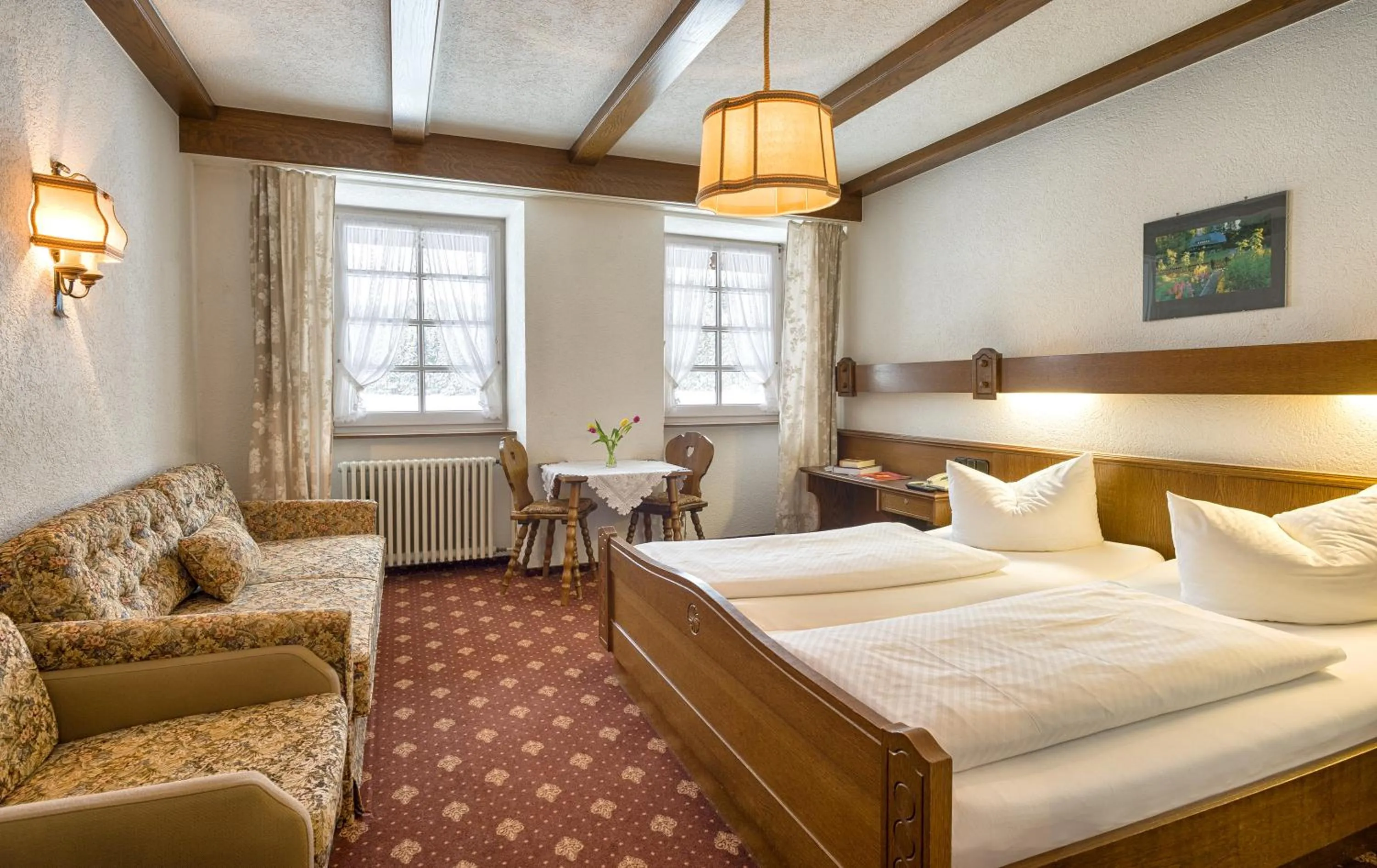 Photo of the whole room, Bed in ZUR TRAUBE Schwarzwaldhotel & Restaurant am Titisee