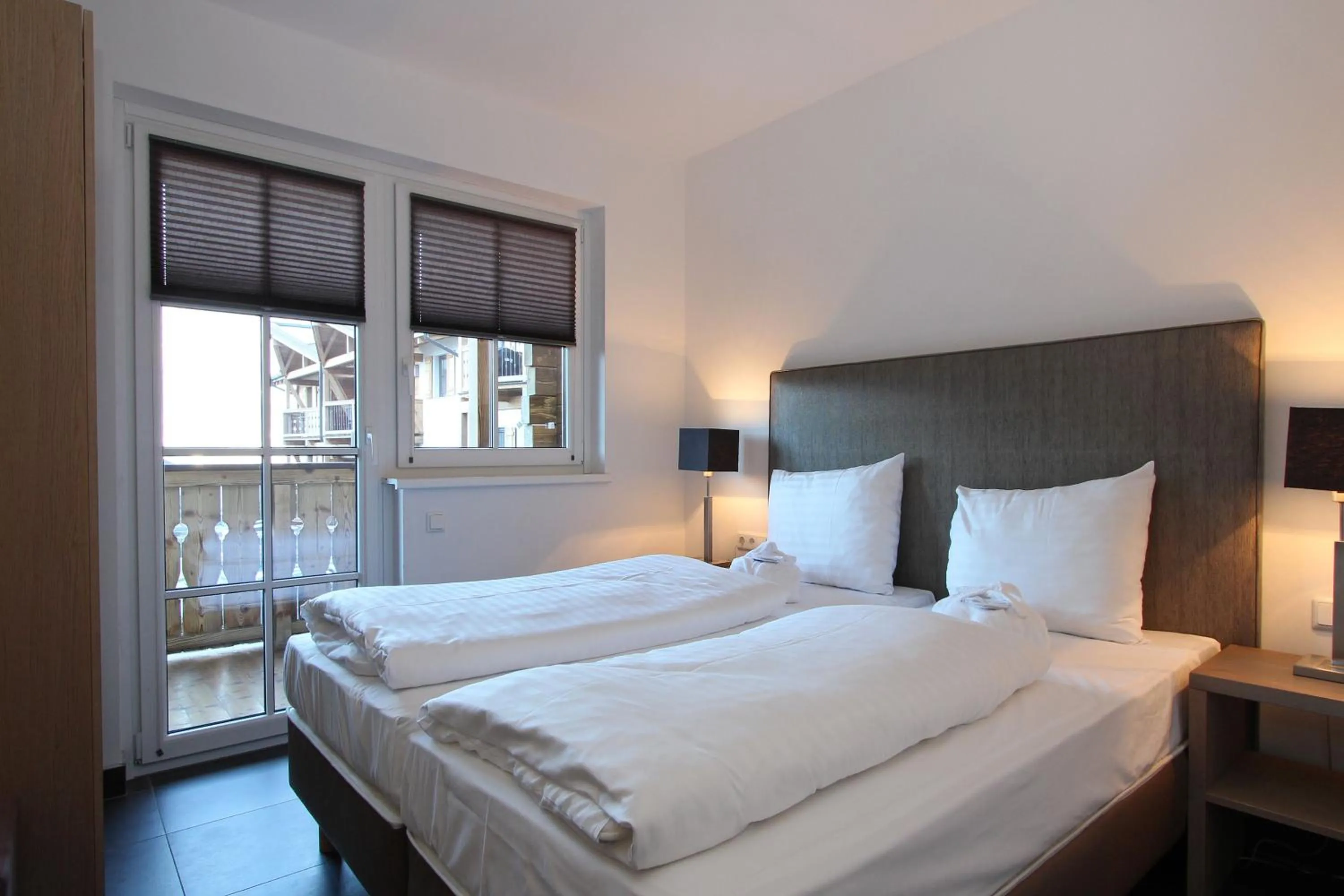 Bed in AvenidA Mountain Resort by Alpin Rentals
