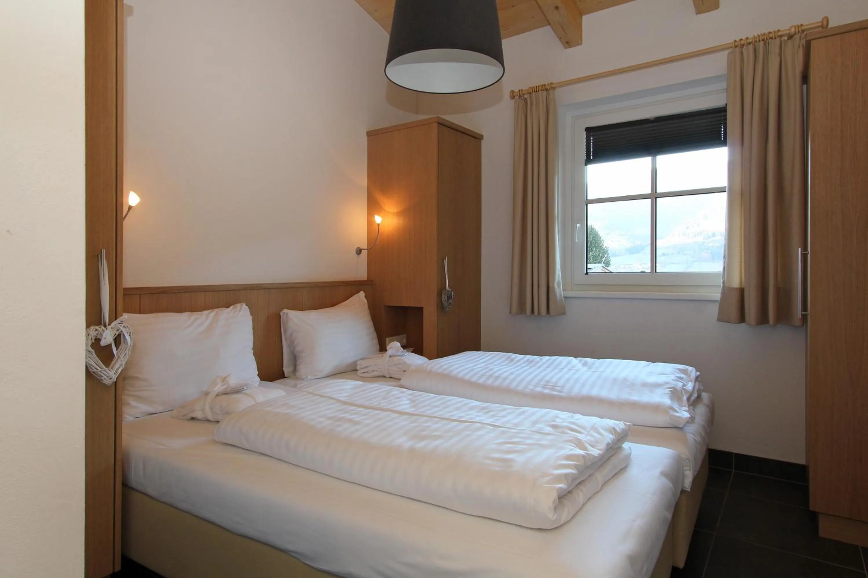 Bed in AvenidA Mountain Resort by Alpin Rentals