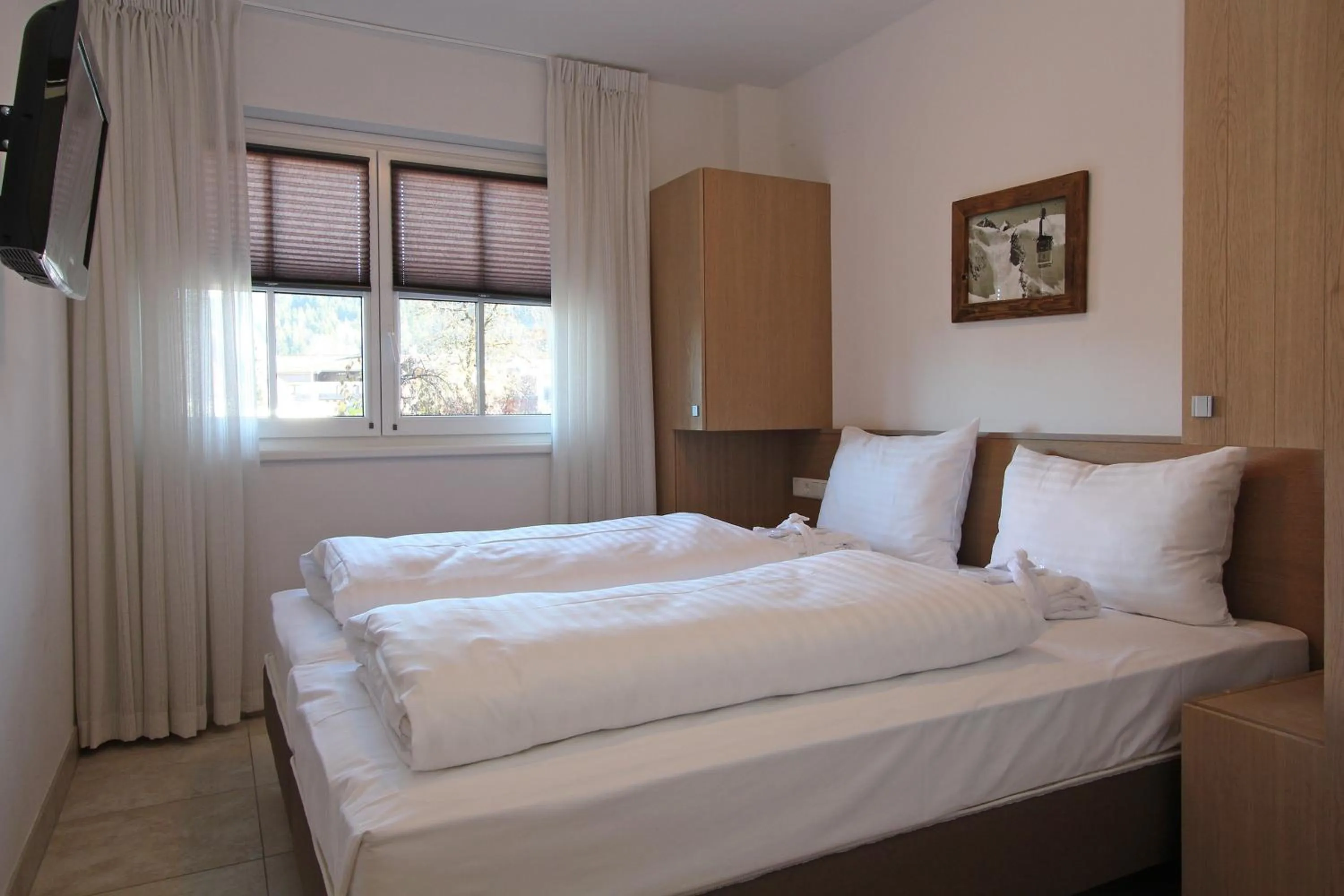 Bed in AvenidA Mountain Resort by Alpin Rentals