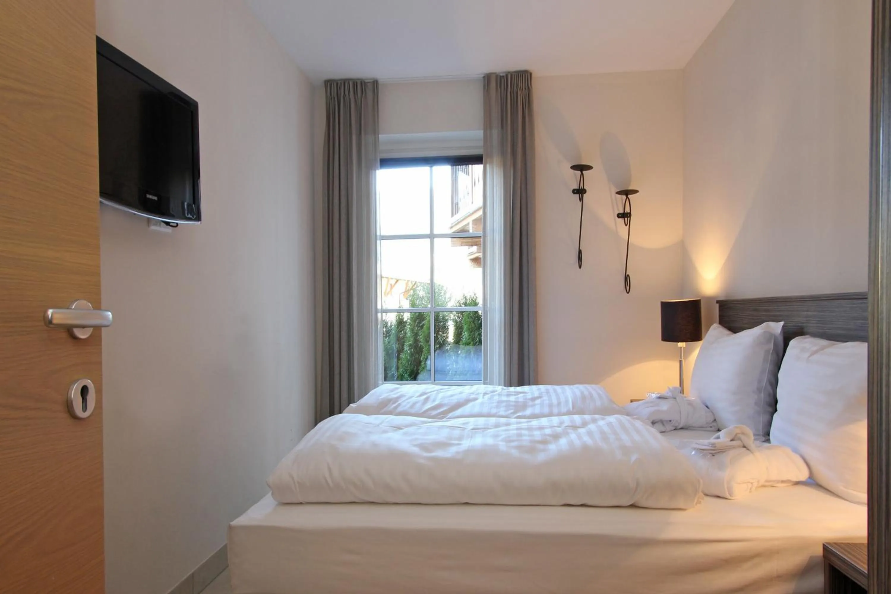 Bed in AvenidA Mountain Resort by Alpin Rentals