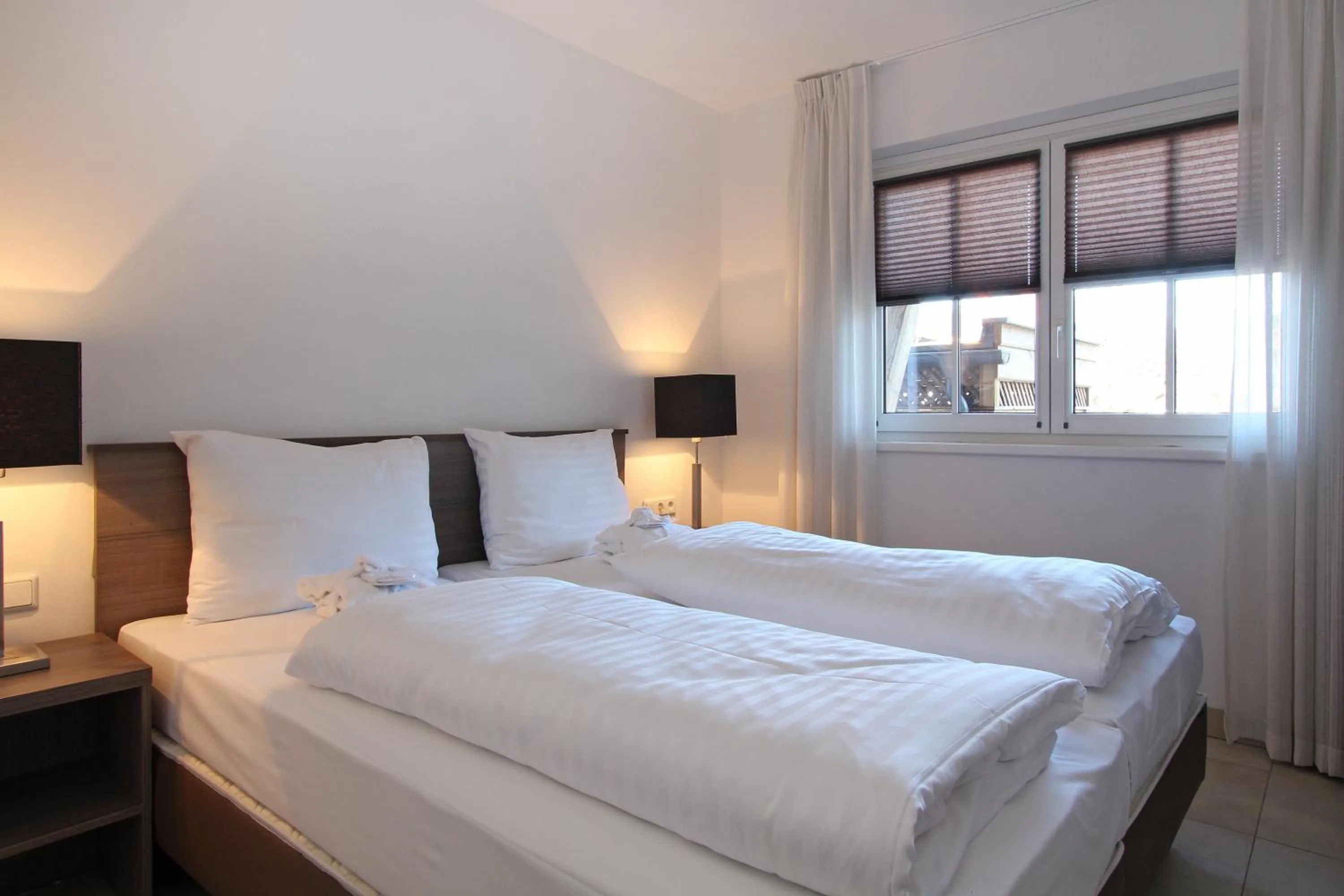 Bed in AvenidA Mountain Resort by Alpin Rentals