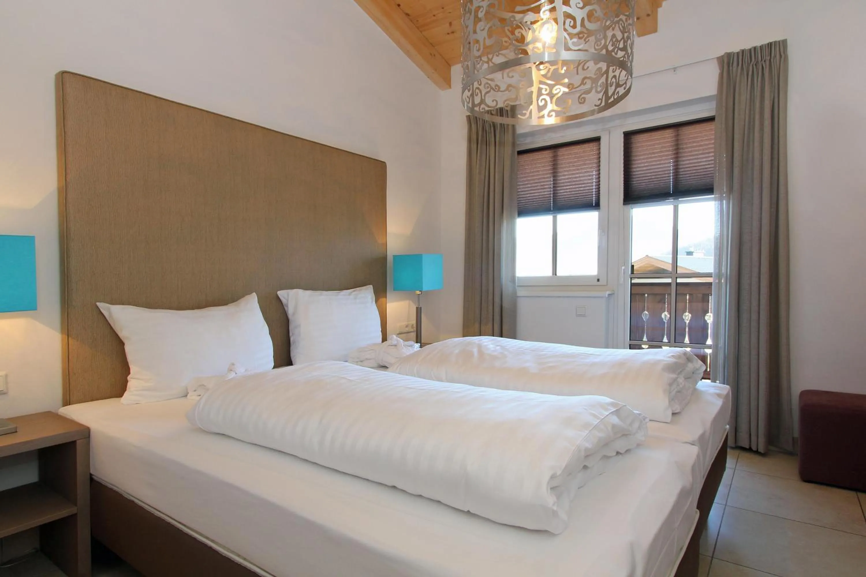Bed in AvenidA Mountain Resort by Alpin Rentals