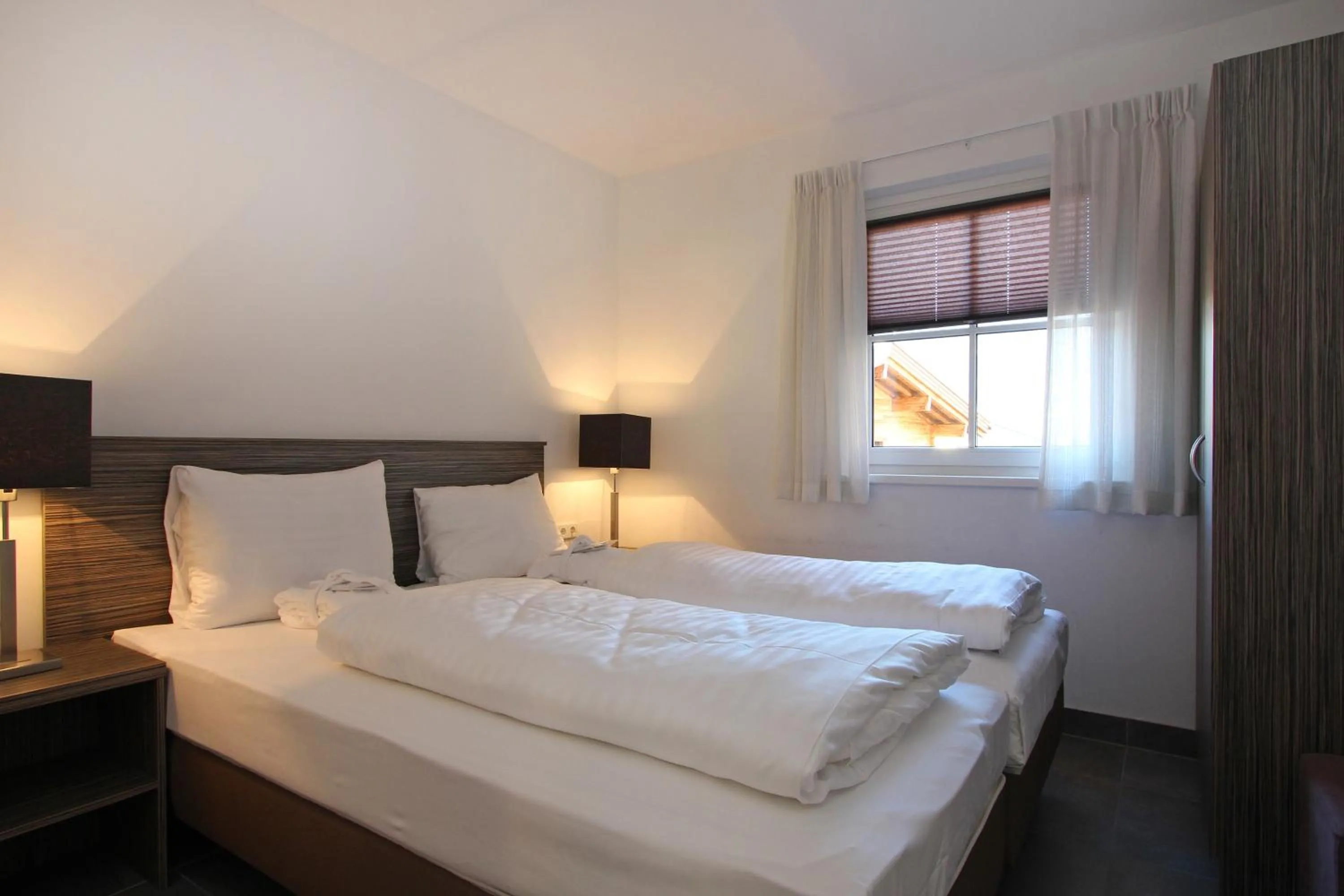 Bed in AvenidA Mountain Resort by Alpin Rentals