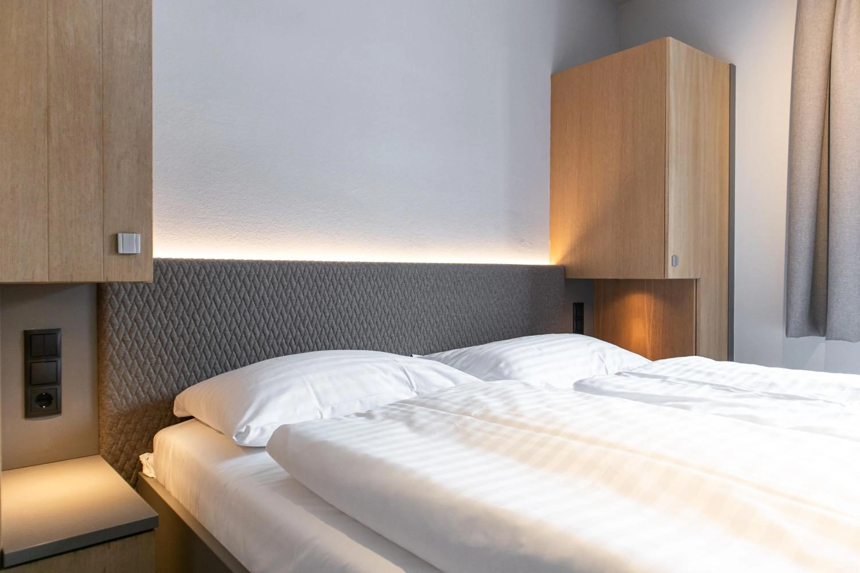 Bed in AvenidA Mountain Resort by Alpin Rentals