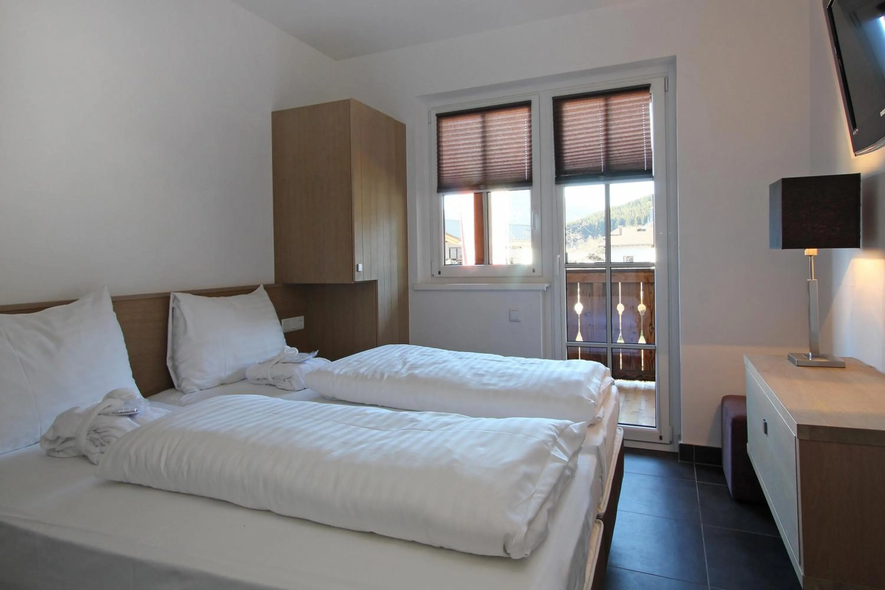 Bed in AvenidA Mountain Resort by Alpin Rentals