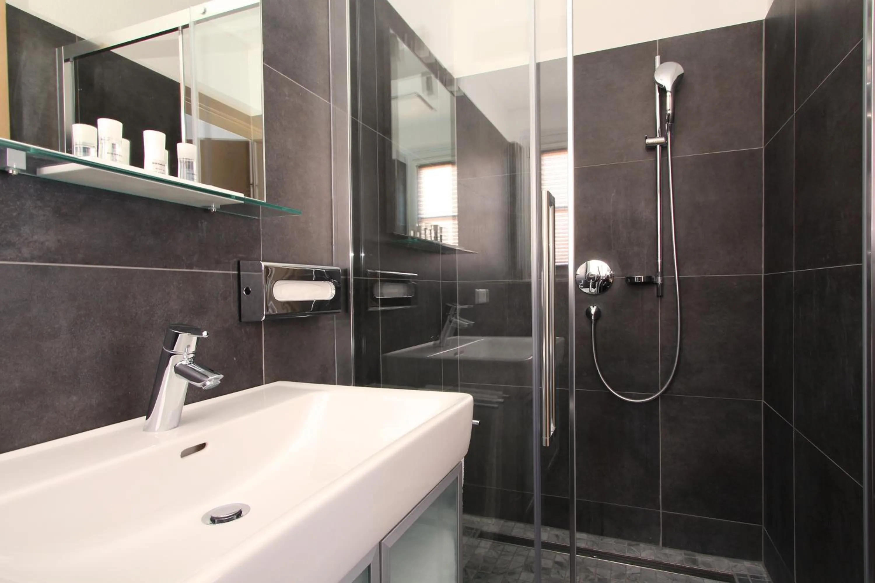 Shower in AvenidA Mountain Resort by Alpin Rentals