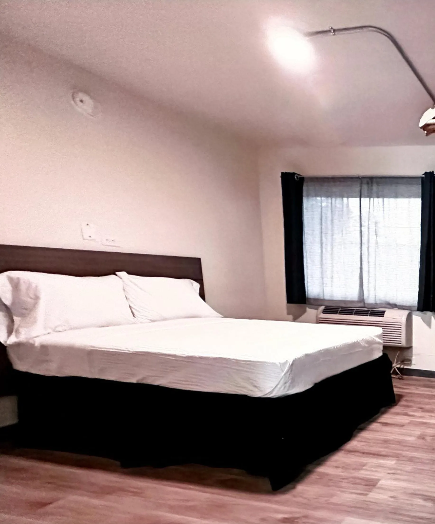 Bed in Studio City Suites, a Travelodge by Wyndham