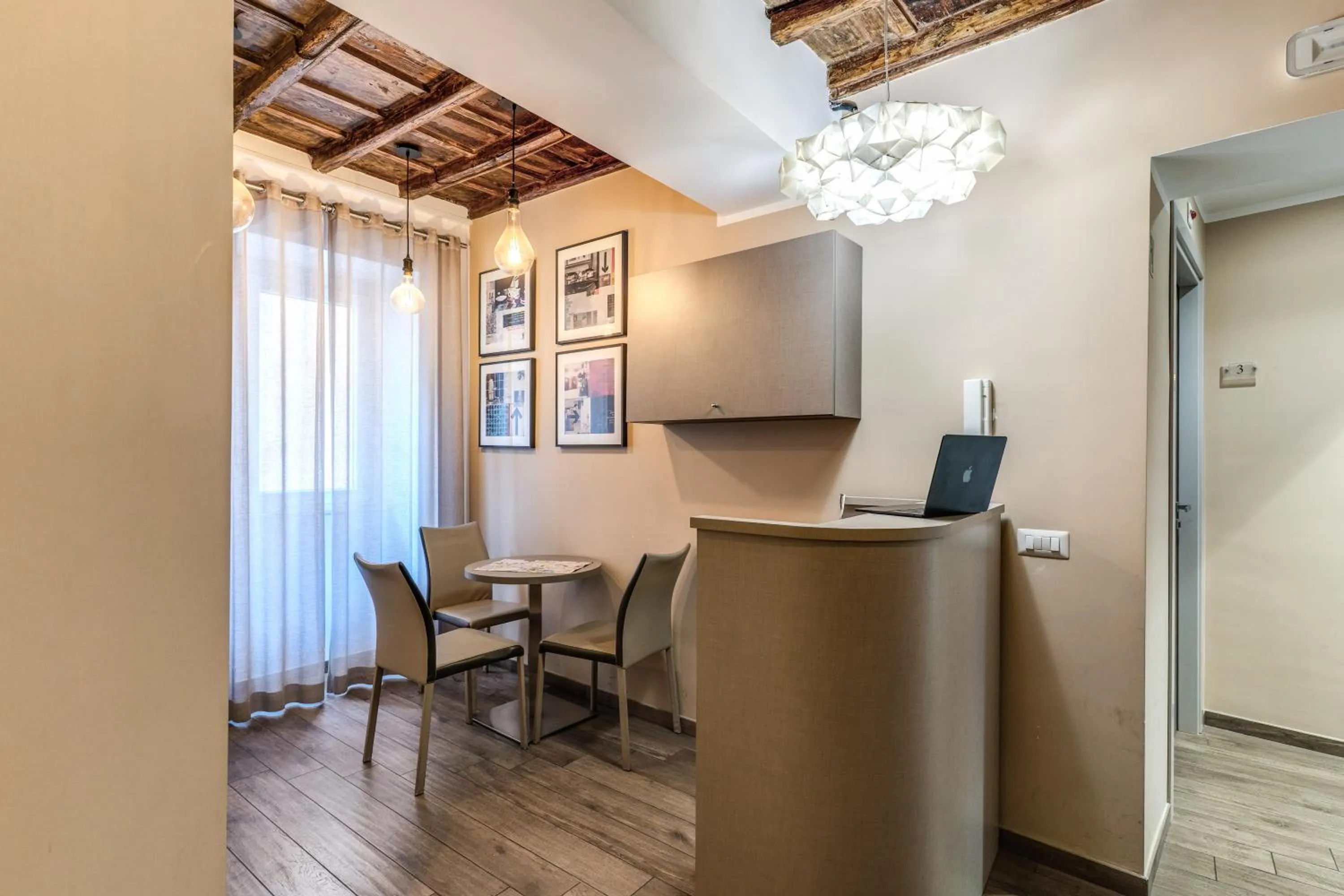 Communal lounge/ TV room in Reginella Suites