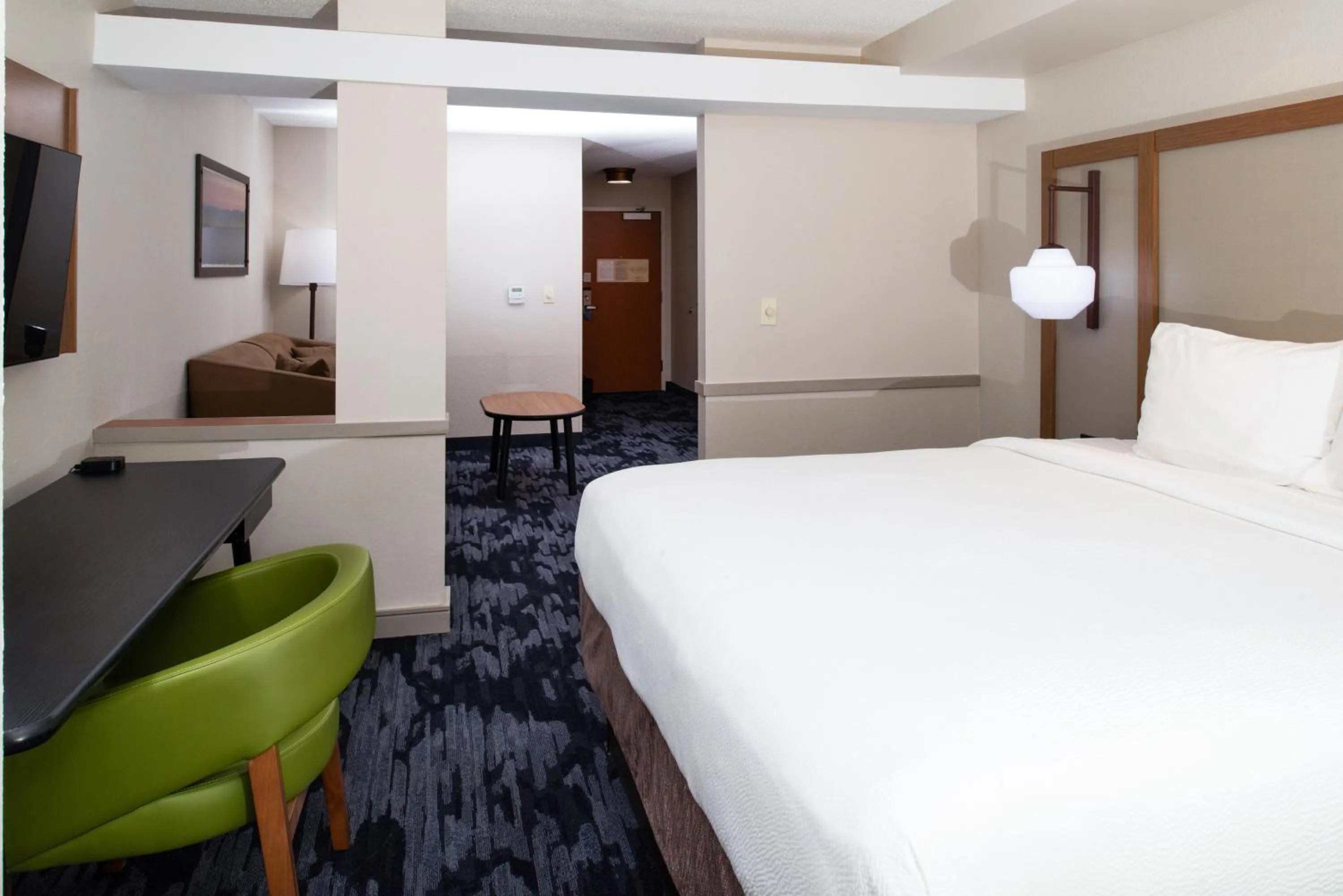 Seating area, Bed in Fairfield Inn & Suites Greensboro Wendover