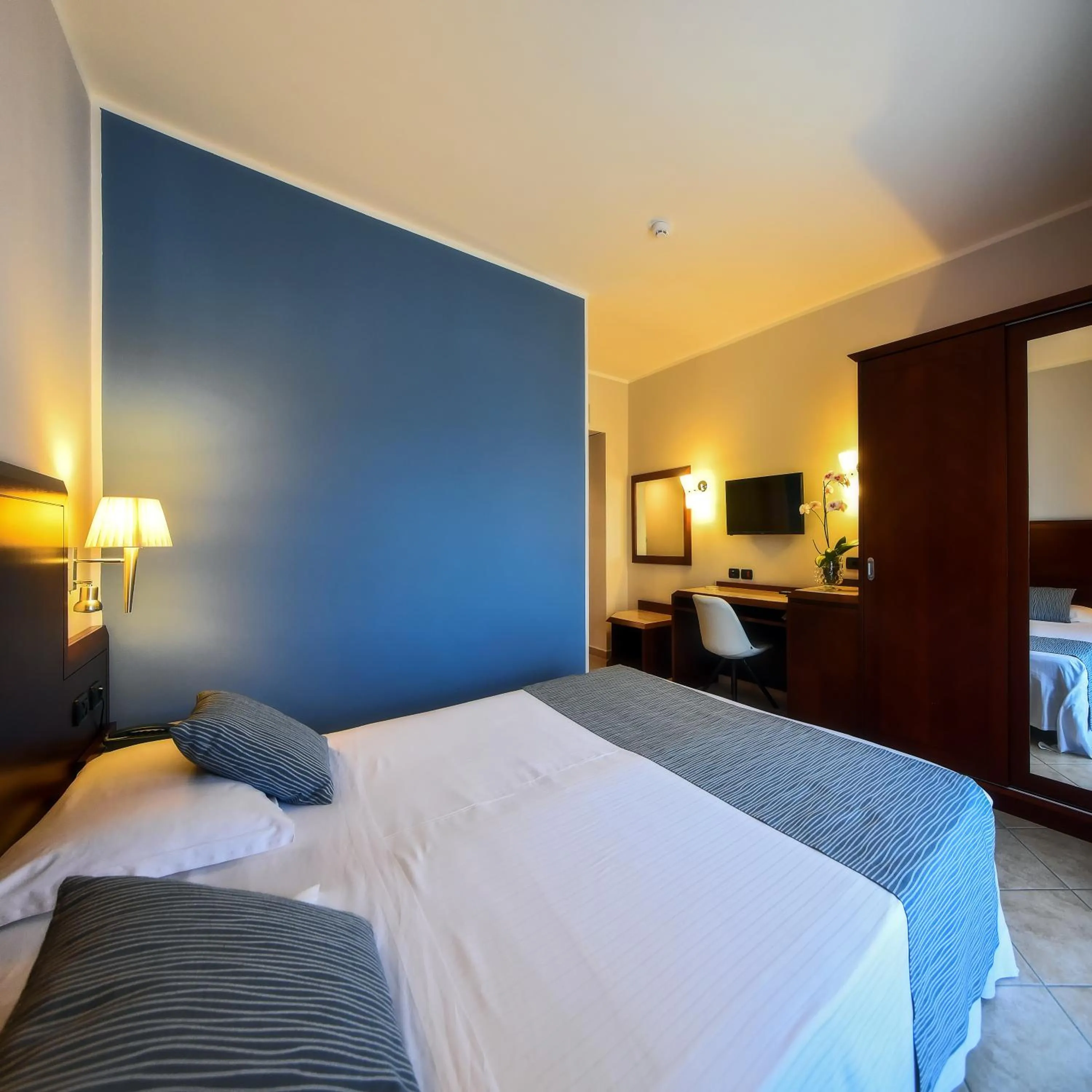 Bed in Hotel Le Palme