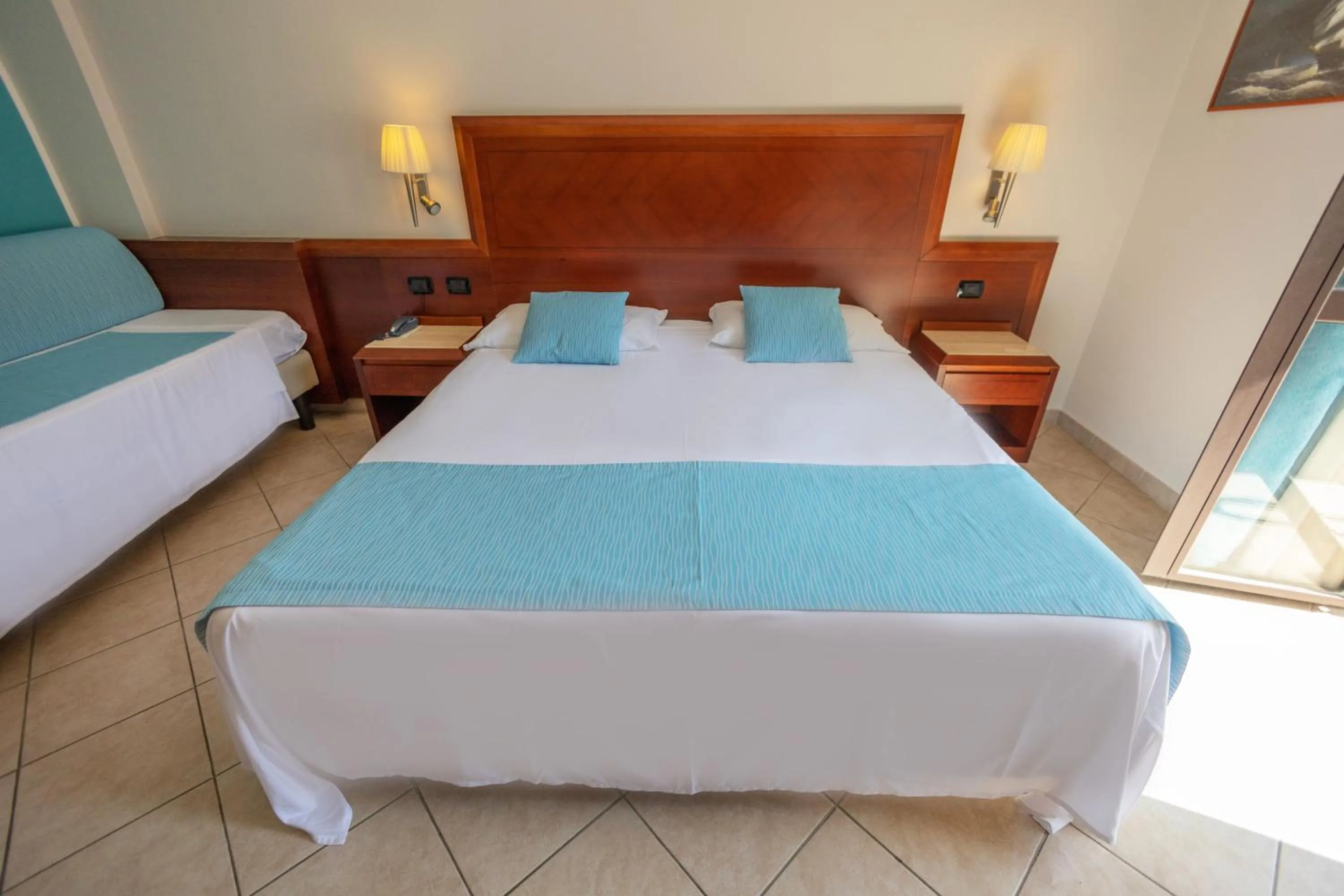 Bed in Hotel Le Palme