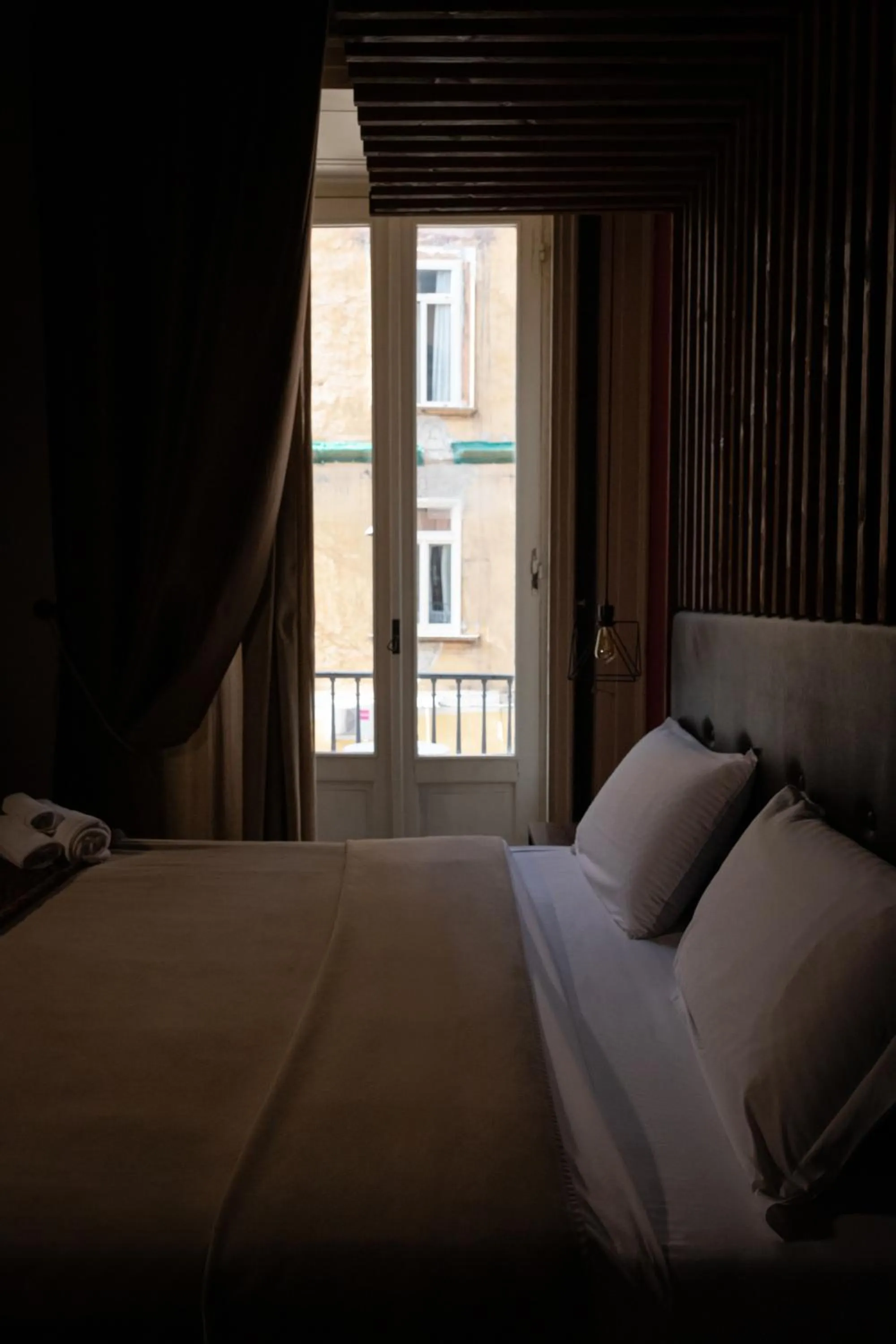 Bed in Duomo Luxury Suites