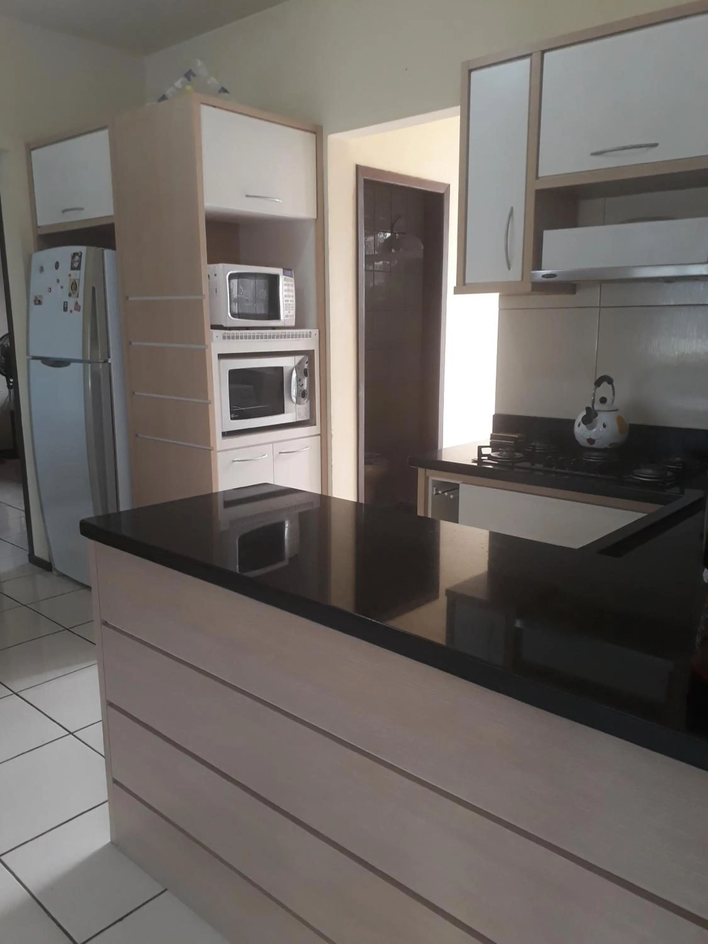 Kitchen or kitchenette in Casa de Praia Navegantes - 100 metros do mar