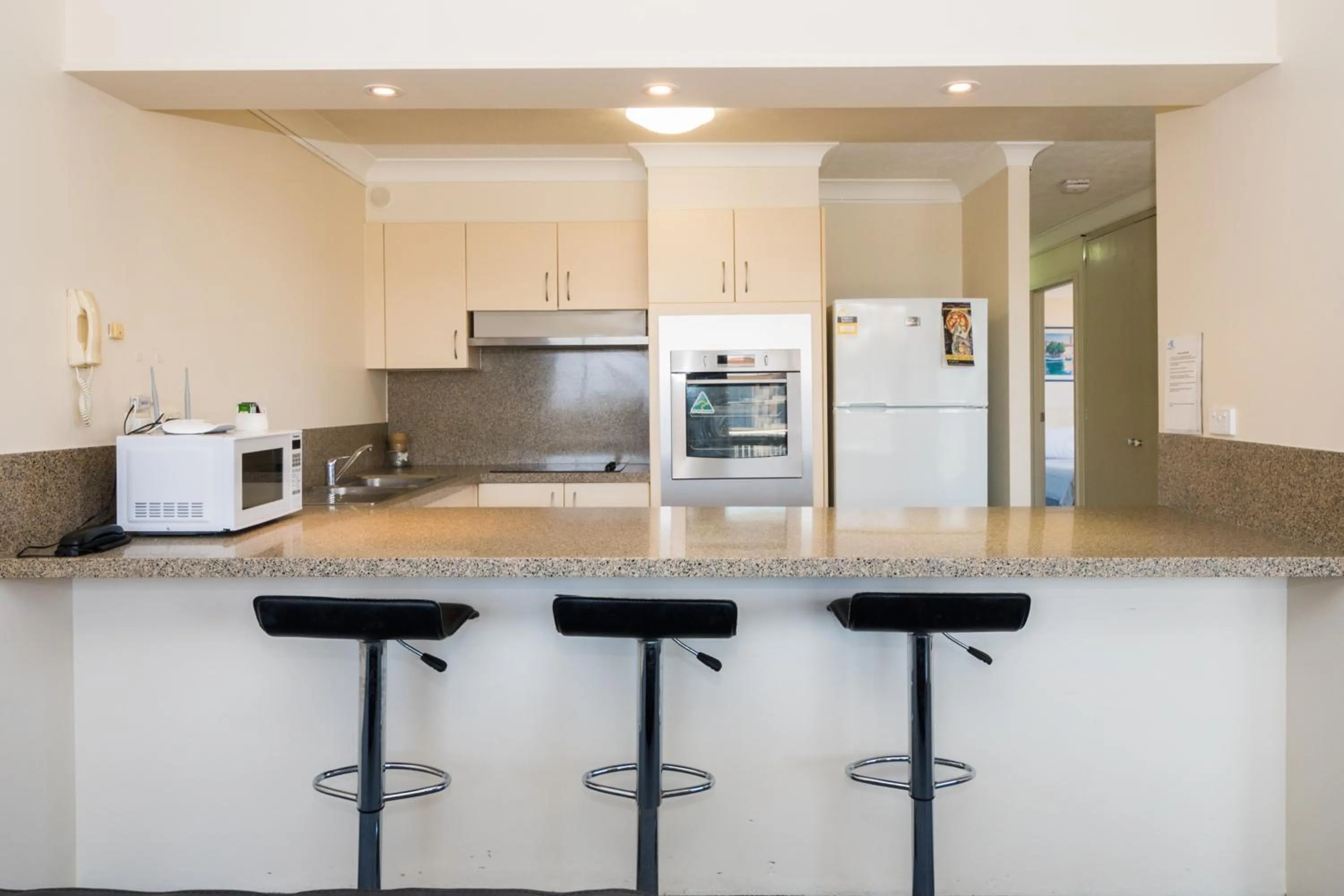 Kitchen or kitchenette in Breakers North Absolute Beachfront Apartments - Official